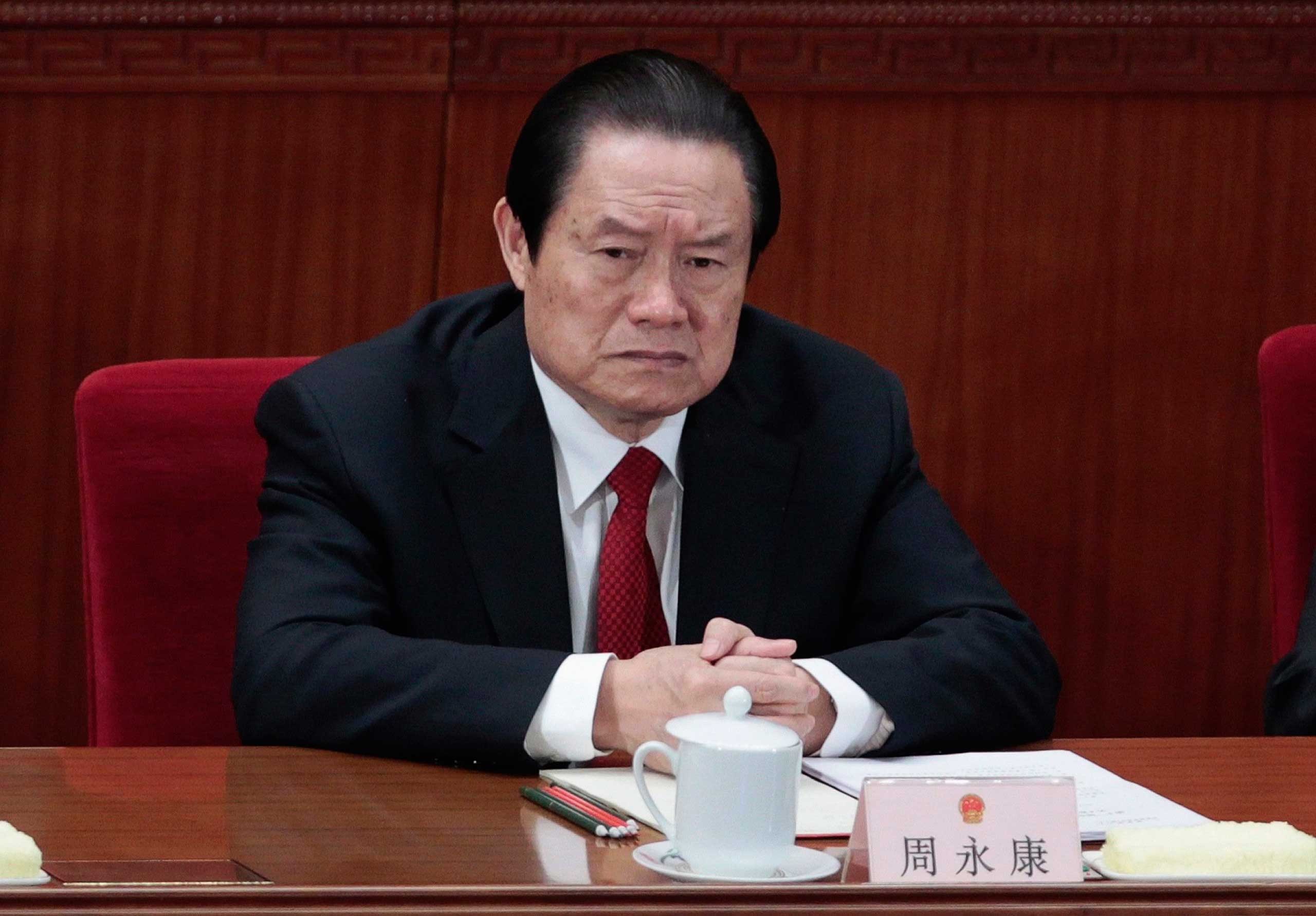 China's former Politburo Standing Committee Member Zhou Yongkang attends the closing ceremony of the National People's Congress (NPC) at the Great Hall of the People in Beijing, March 14, 2012. (Jason Lee—Reuters)