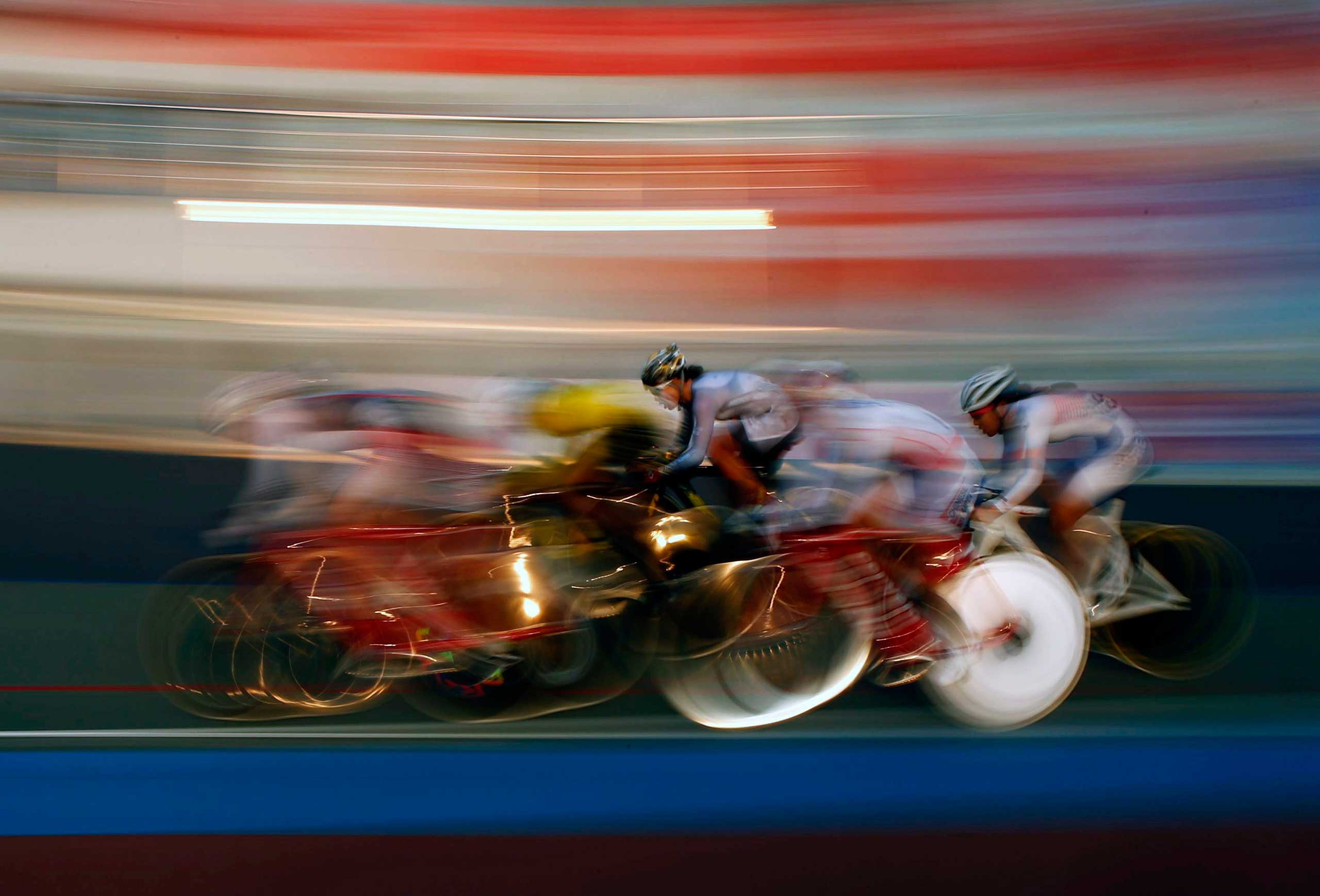 The pack races in the track cycling women's omnium 25km point race at the Incheon International Velodrome during the 17th Asian Games Sept. 25, 2014.