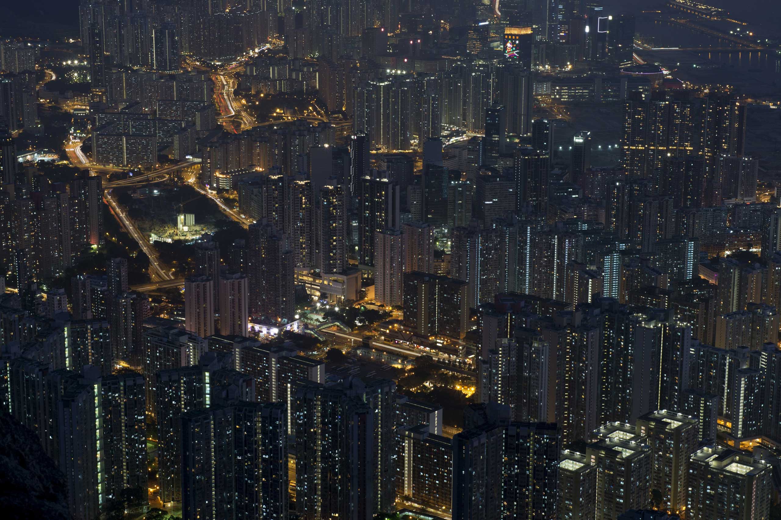 This long exposure picture shows apartment buildings and office blocks clustered together in Hong Kong's Kowloon district on Feb. 3, 2014.