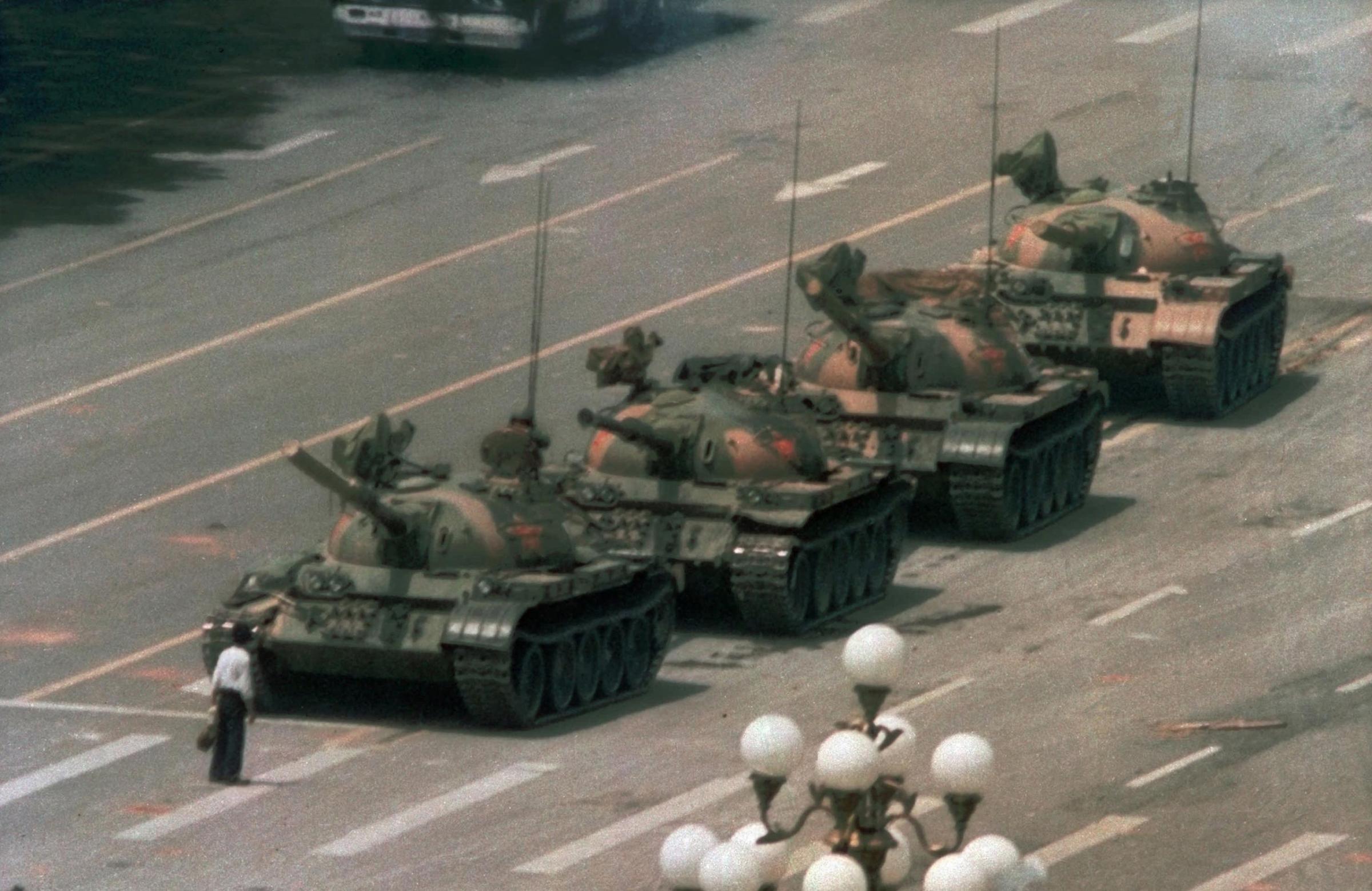 A Chinese man stands alone to block a line of tanks heading east on Beijing's Cangan Blvd. in Tiananmen Square on June 5, 1989.