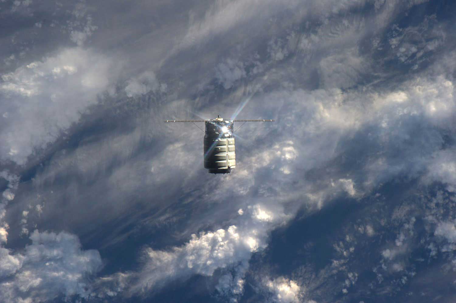 The unmanned U.S. commercial cargo ship Cygnus is seen approaching the International Space Station on Sept. 29, 2013. Cygnus flew itself to the International Space Station, completing the primary goal of its debut test flight before Station supply runs begin in December.