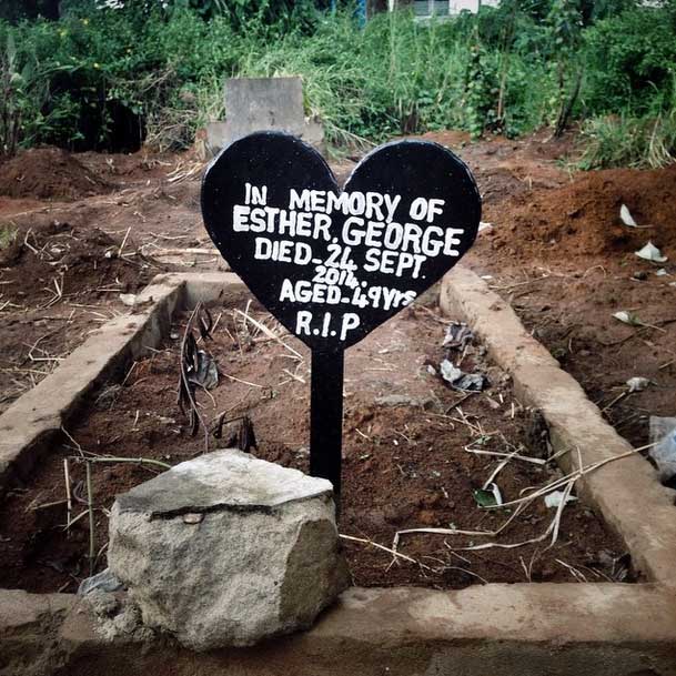 At King Tom Cemetery in Freetown, Sierra Leone, most of the graves are freshly dug and unmarked. Esther George, a health worker who died of Ebola, had the only permanent nameplate in the whole area. Yesterday the crowded ebola section received 25 bodies. #onassignment for @wsjphotos in #Freetown #sierraleone covering #ebola