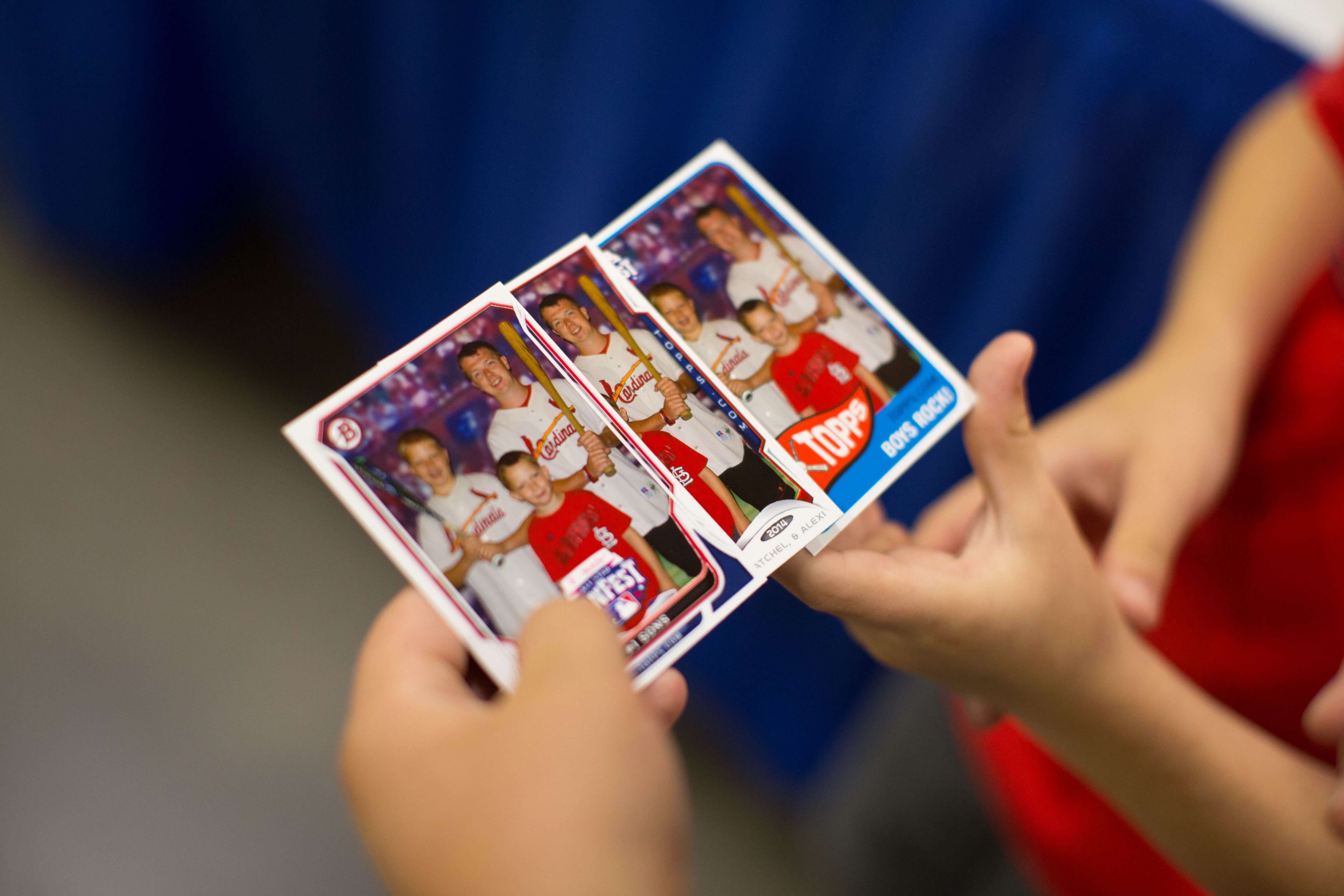 Fans hold Topps Baseball  same day baseball cards during the T-Mobile Major League Baseball All-Star FanFest at the Minneapolis Convention Center on Friday, July 11, 2014 in Minneapolis, Minnesota. (Taylor Baucom—MLB Photos via Getty Images)
