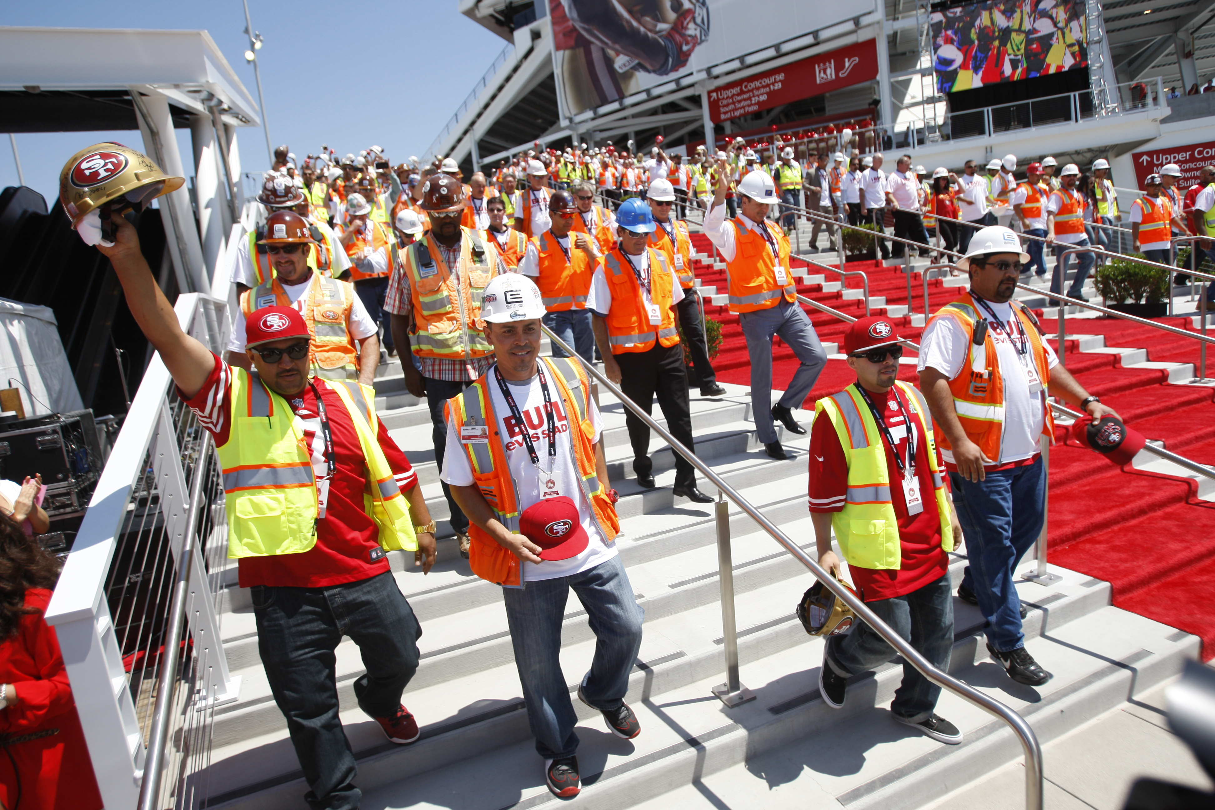 Workers head down the stairs during the Ribbon Cutting Ceremony for Levi Stadium on July 17, 2014 in Santa Clara, California. (Michael Zagaris&mdash;Getty Images)