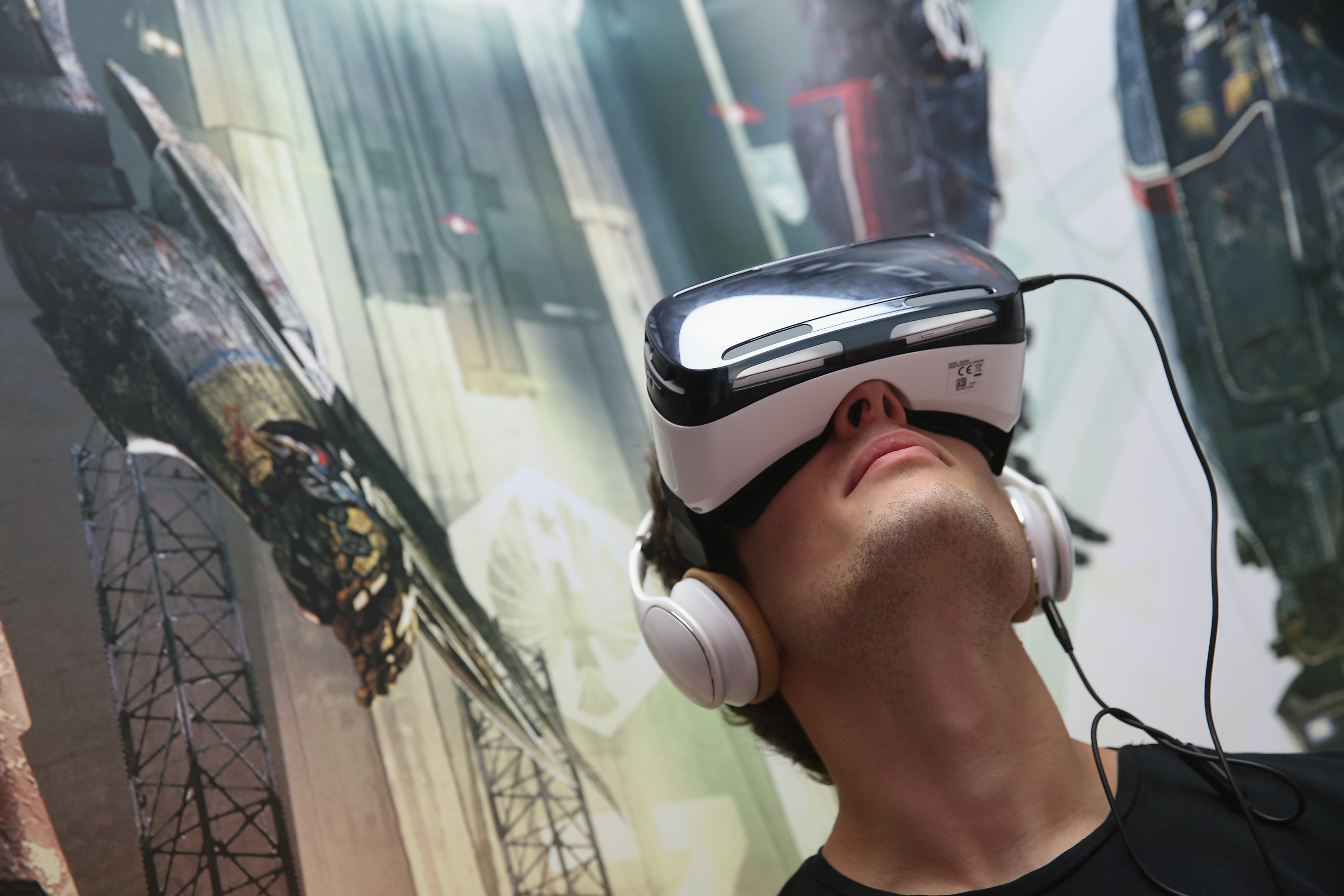 A visitor tries out Gear VR virtual reality goggles amd headphones at the Samsung stand at the 2014 IFA home electronics and appliances trade fair on September 5, 2014 in Berlin. (Sean Gallup&mdash;Getty Images)