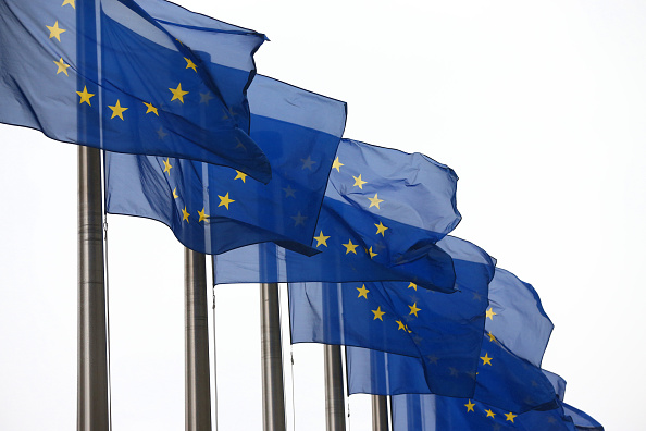E.U. flags are pictured outside the European Commission building in Brussels on Oct. 24, 2014. (Carl Court—Getty Images)