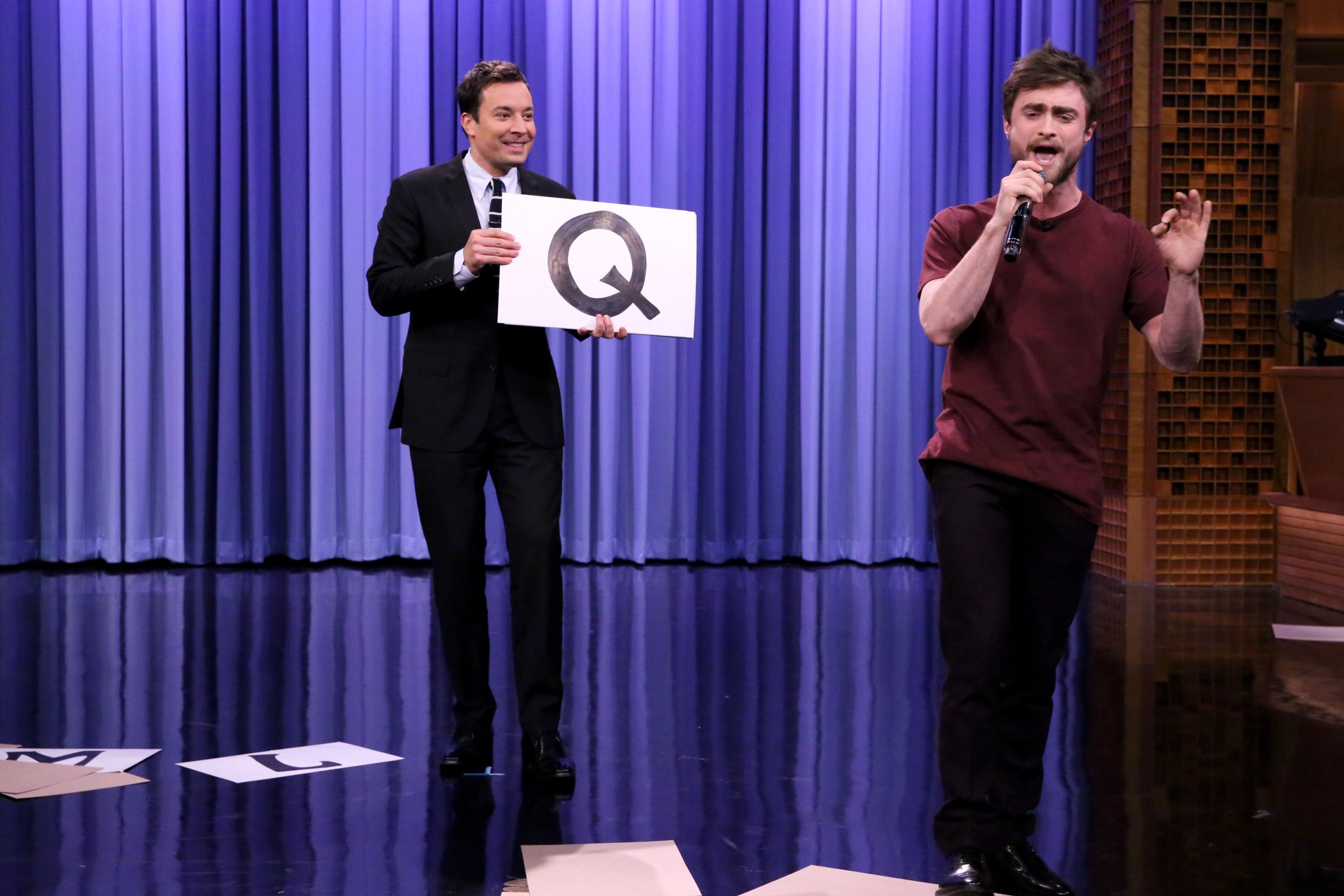 THE TONIGHT SHOW STARRING JIMMY FALLON -- Episode 0150 -- Pictured: (l-r) Host Jimmy Fallon watches as actor Daniel Radcliffe performs the "Alphabet Aerobics" rap by Blackalicious on October 28, 2014 -- (Photo by: Douglas Gorenstein/NBC/NBCU Photo Bank)