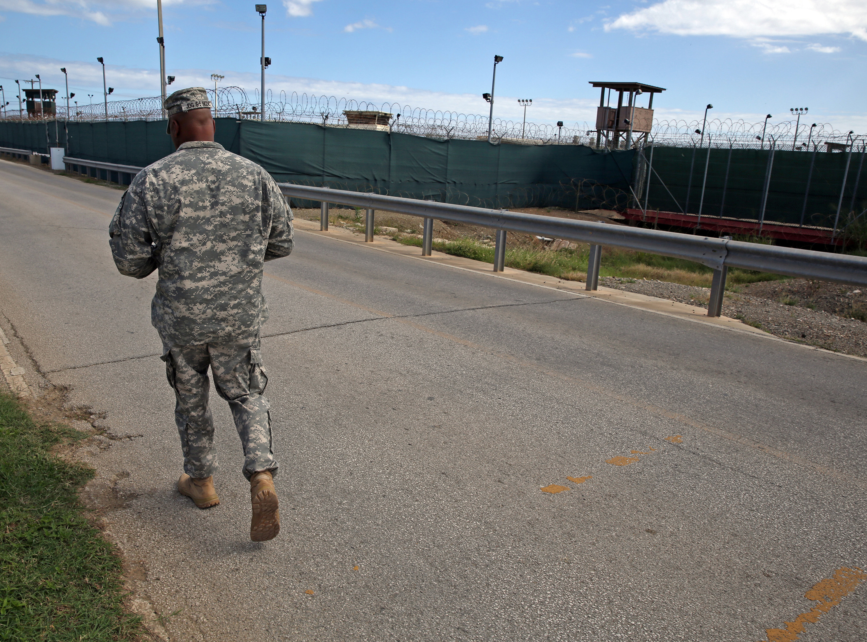 A soldier walks by Camp Delta, which no longer holds detainees, on Tuesday, Nov. 4, 2014 at the U.S. Navy base at Guantanamo Bay, Cuba in this photo approved for release by the U.S. military. (Miami Herald&mdash;TNS via Getty Images)
