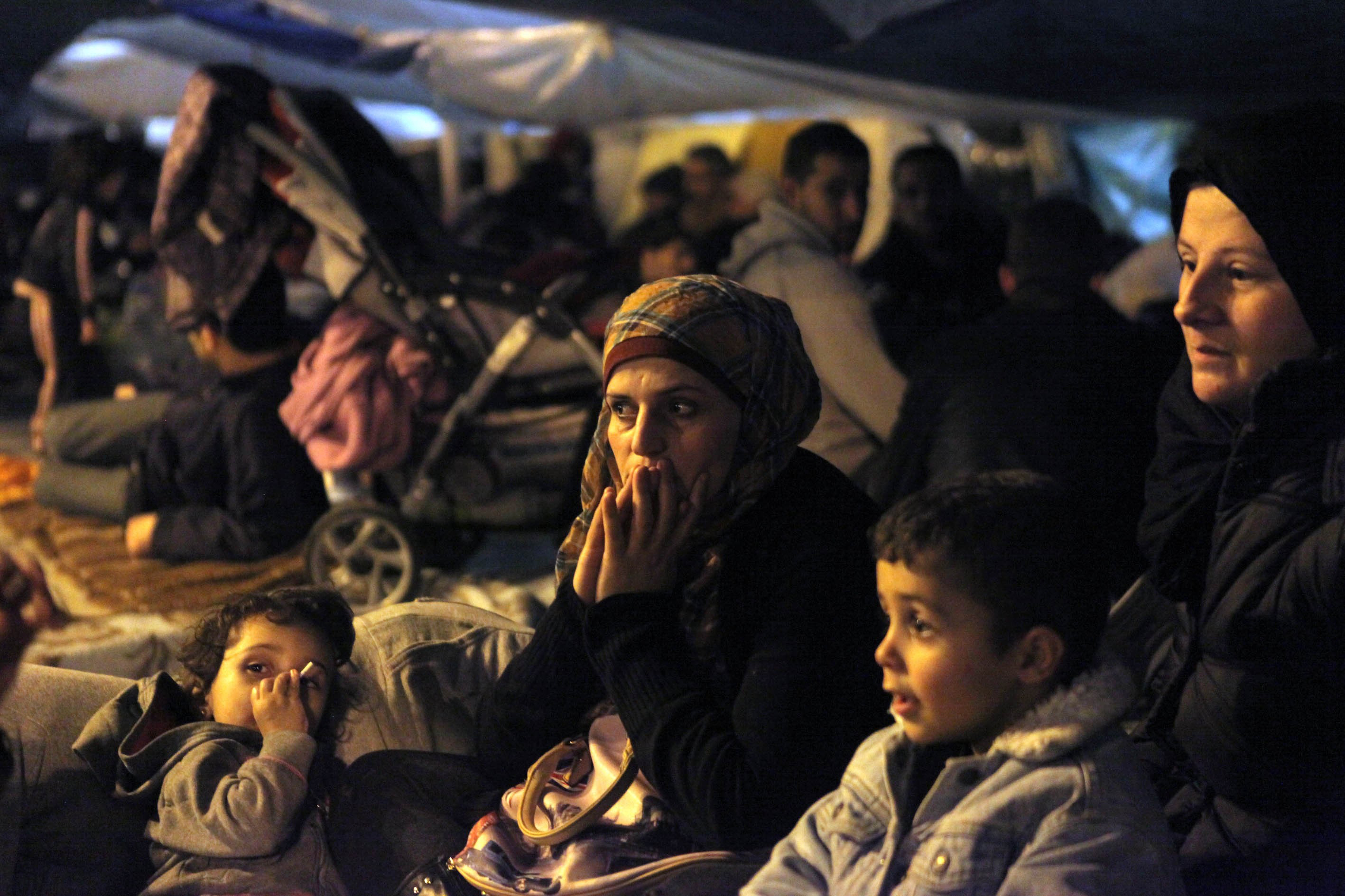Syrian refugees wait in tents during a hunger strike outside the parliamentary building in Athens on Nov. 30, 2014 (Anadolu Agency—Getty Images)