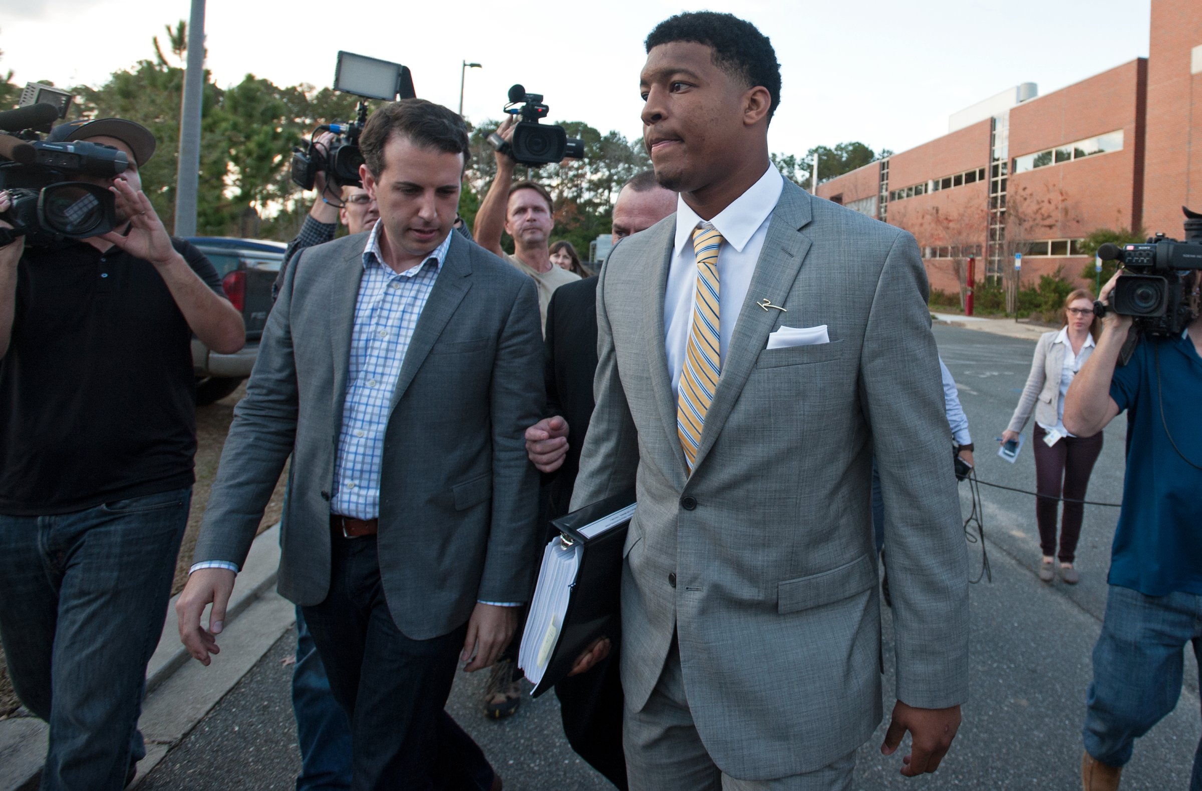 Florida State Seminoles quaterback Jameis Winston leaves his student conduct code hearing in Tallahassee, Florida on Dec. 2, 2014.