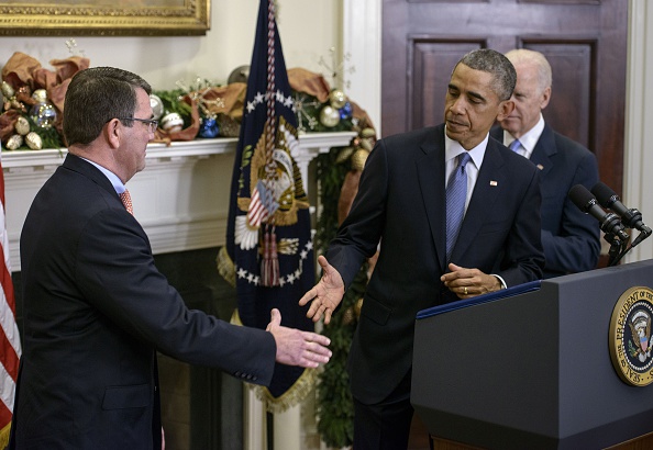 President Obama congratulates Ashton Carter after announcing his intention to nominate him to be the next defense secretary Friday. (BRENDAN SMIALOWSKI / AFP / Getty Images)