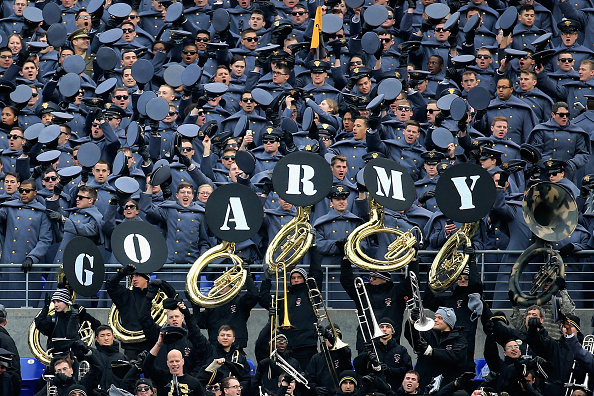 Army cadets cheer on their football team Saturday in their annual game against Navy. (Rob Carr / Getty Images)