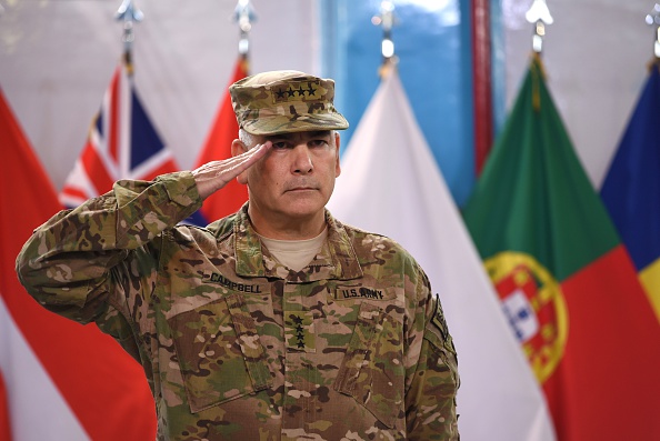 U.S. Army General John Campbell salutes during a ceremony marking the end of the allied combat mission in Afghanistan at his headquarters in Kabul, Dec. 28, 2014. (Shah Marai—AFP/Getty Images)