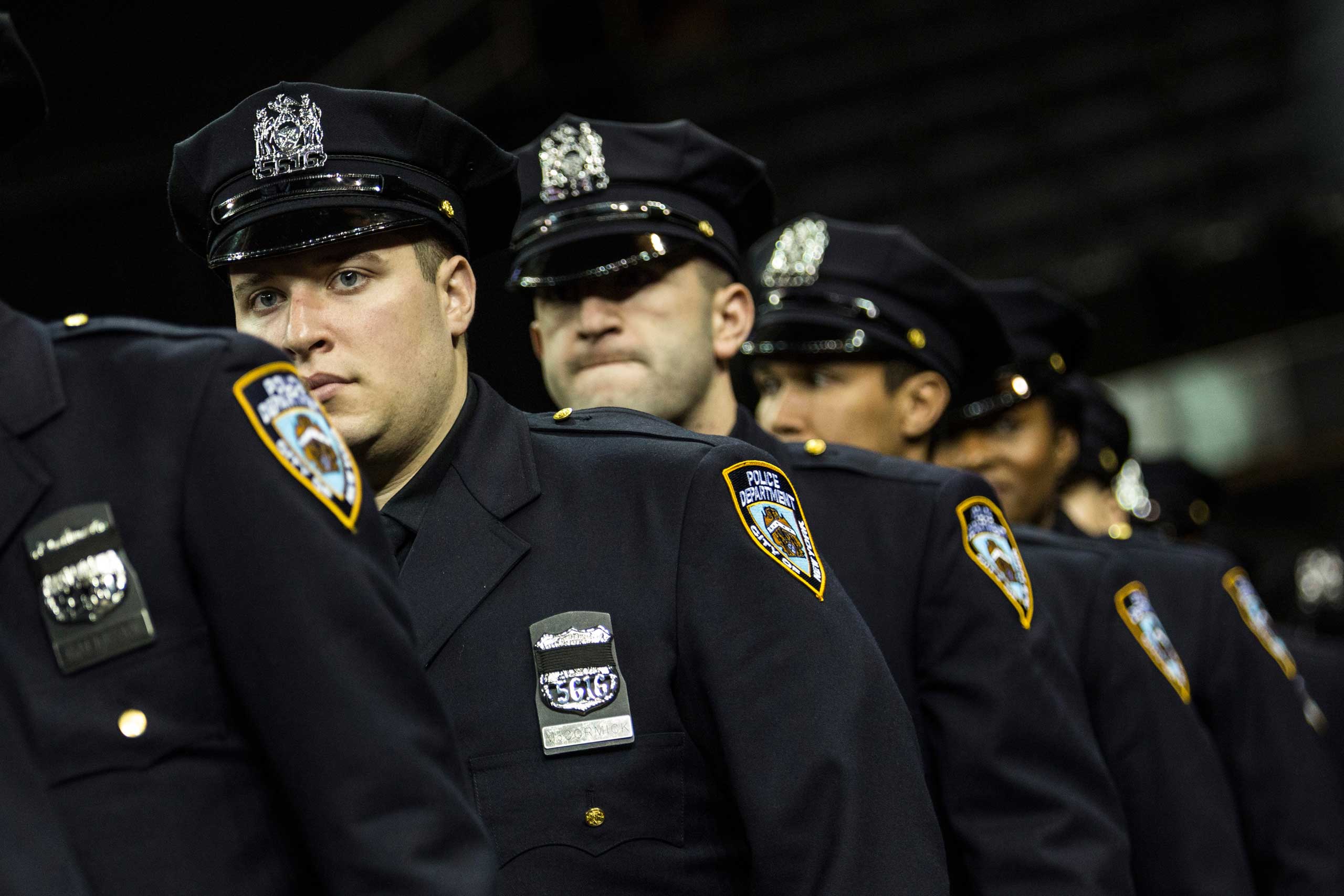 Police officers attend their New York Police Department graduation ceremony at Madison Square Garden on Dec. 29, 2014 in New York City. (Andrew Burton—Getty Images)