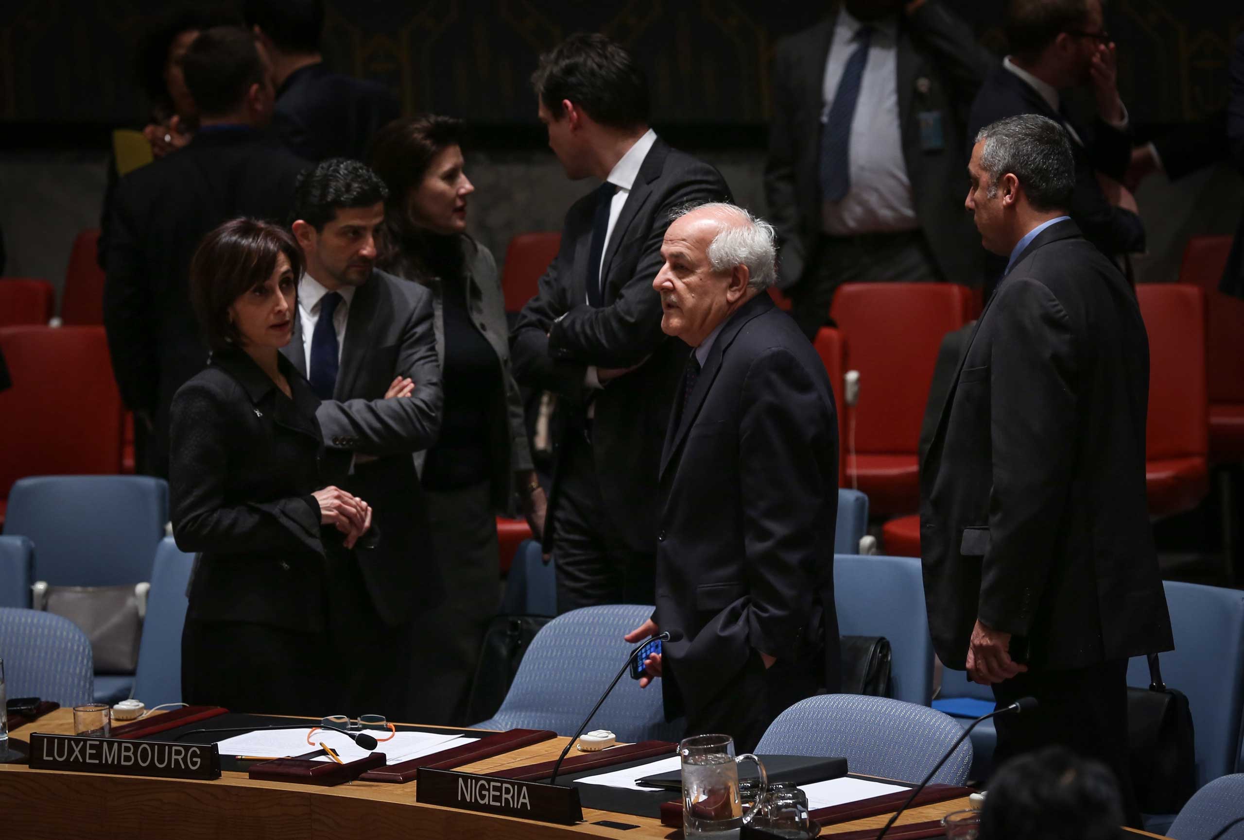 Riyad Mansour, second right, Permanent Observer of Palestine to the United Nations, is seen during the United Nations (UN) Security Council meeting in New York on Dec. 30, 2014. (Cem Ozdel—Anadolu Agency/Getty Images)