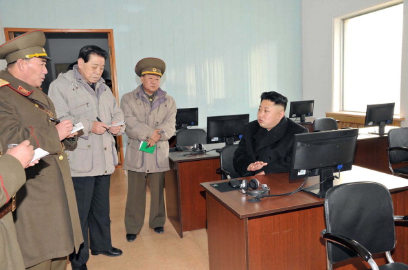 North Korea leader Kim Jong un, seated at right, visits a command center of the North Korean army in this undated photograph provided by North Korea. (AFP / Getty Images)