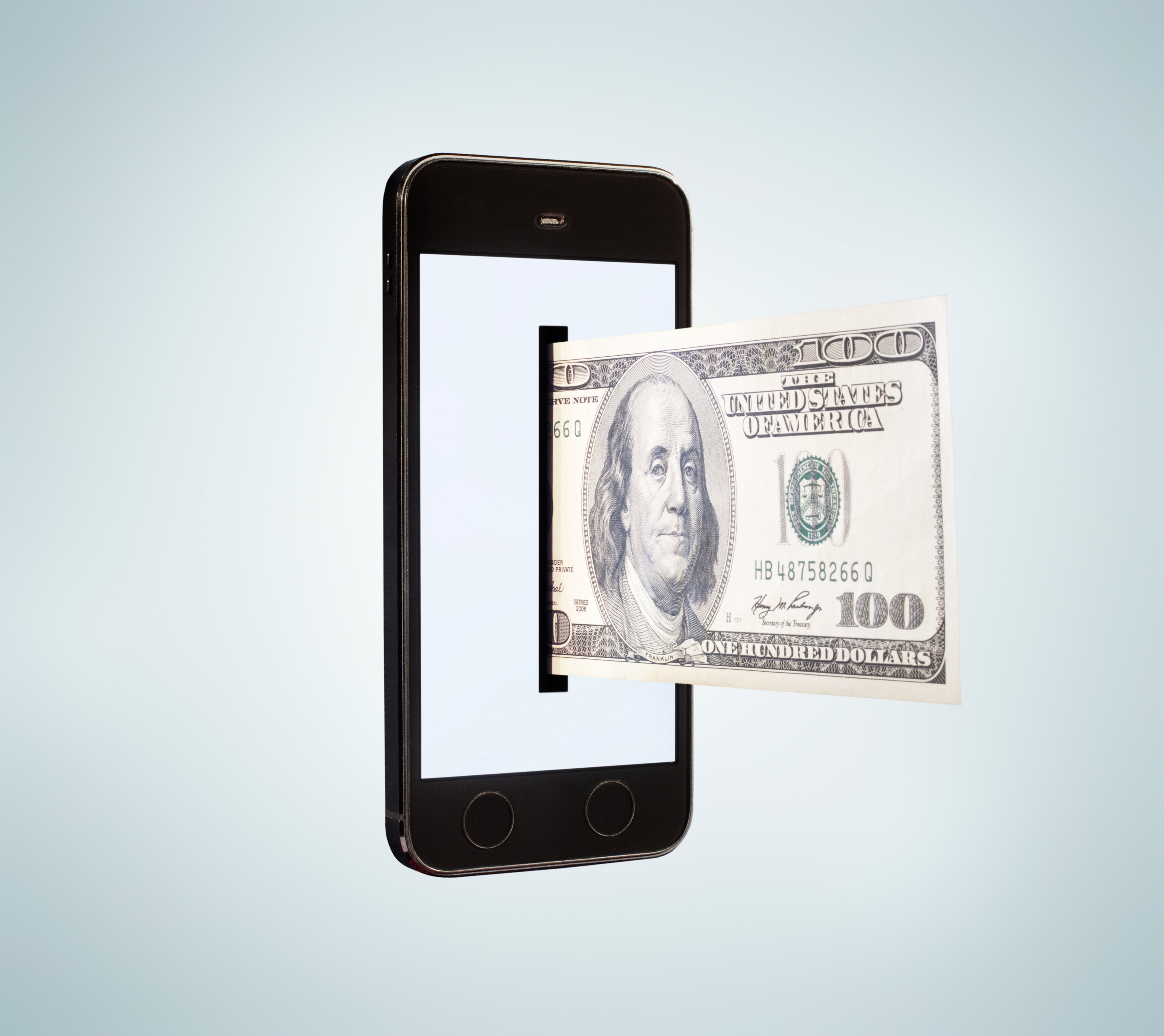 Smartphone dispensing 100 dollar bill. (Tim Robberts&mdash;Getty Images)