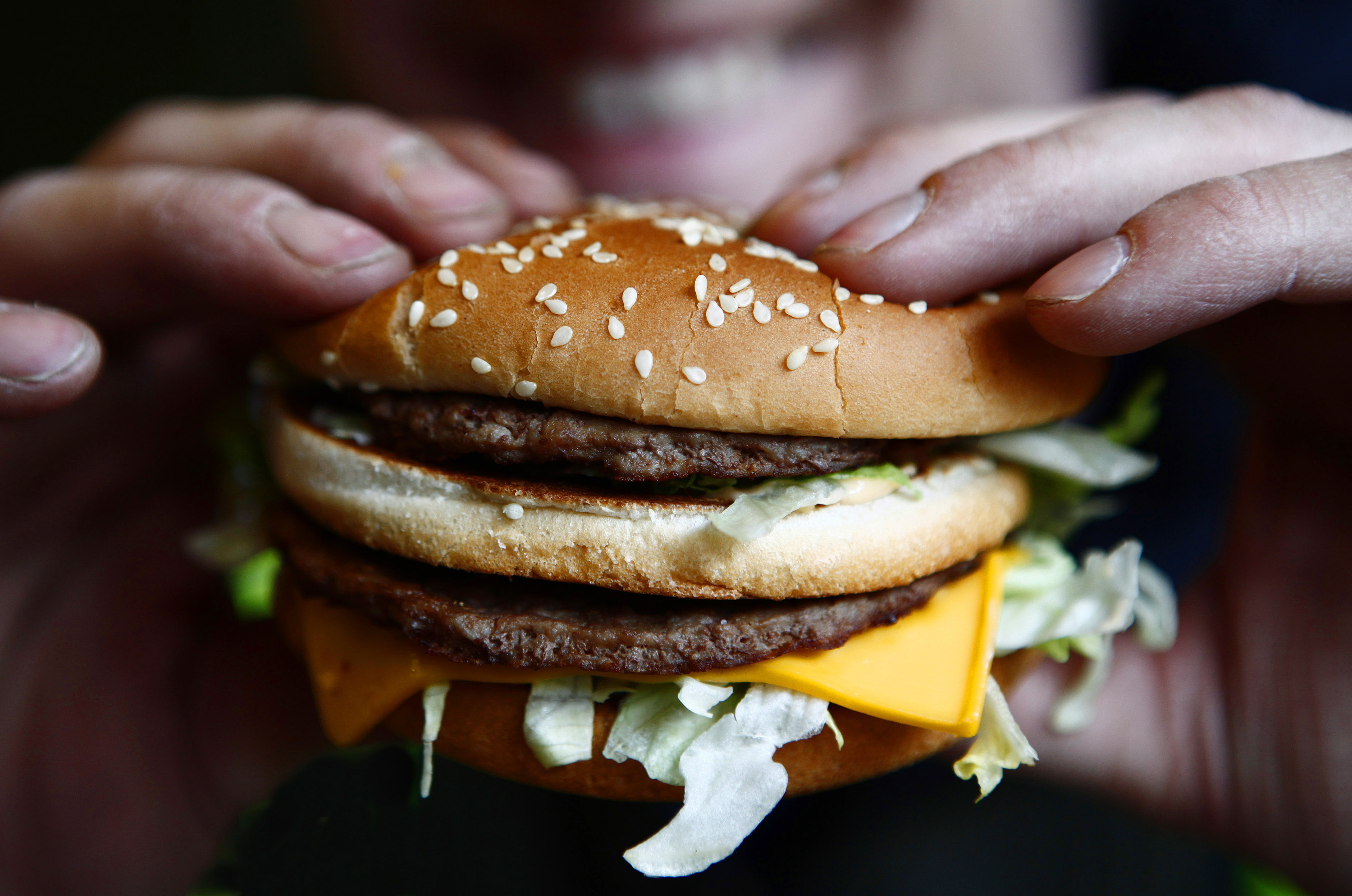 Russell Benjafield holds his Big Mac burger at a McDonald's restaurant in London, U.K., on Monday, Feb. 1, 2010. (Jason Alden—Bloomberg / Getty Images)