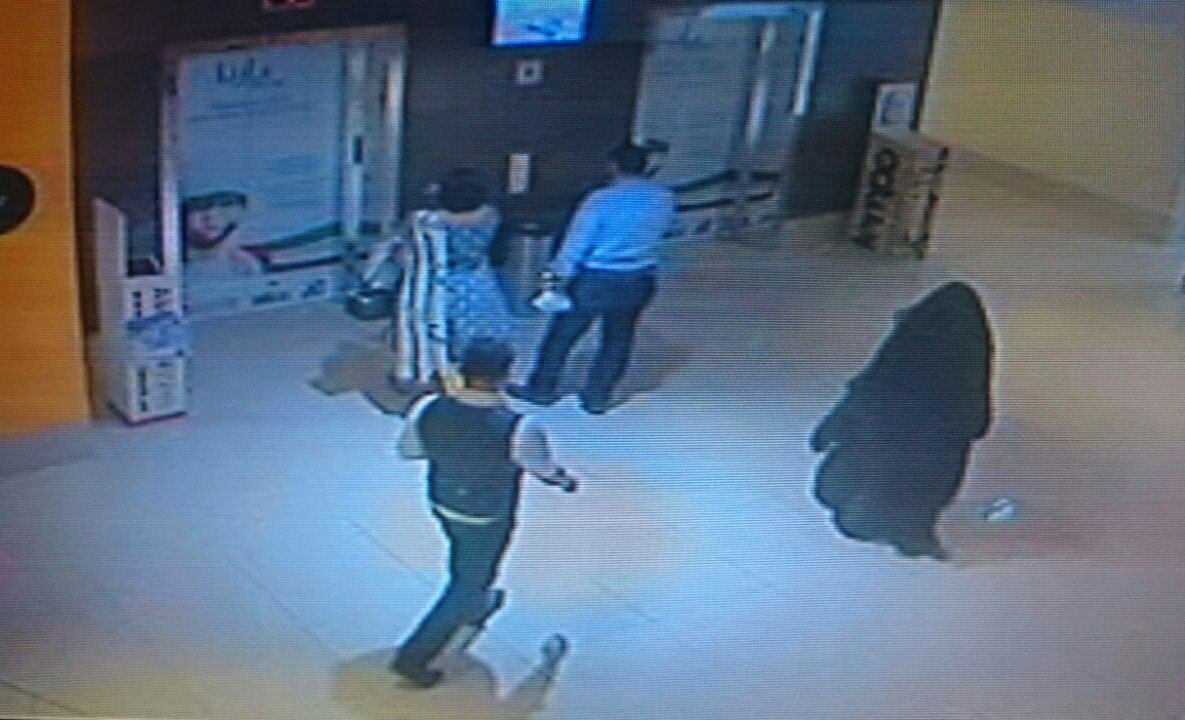A CCTV image shows a fully veiled woman walking in a shopping mall in the Emirati capital, Abu Dhabi. The woman is a suspect in the killing of an American teacher stabbed in the Boutik Mall's toilet. (AFP/Getty Images)