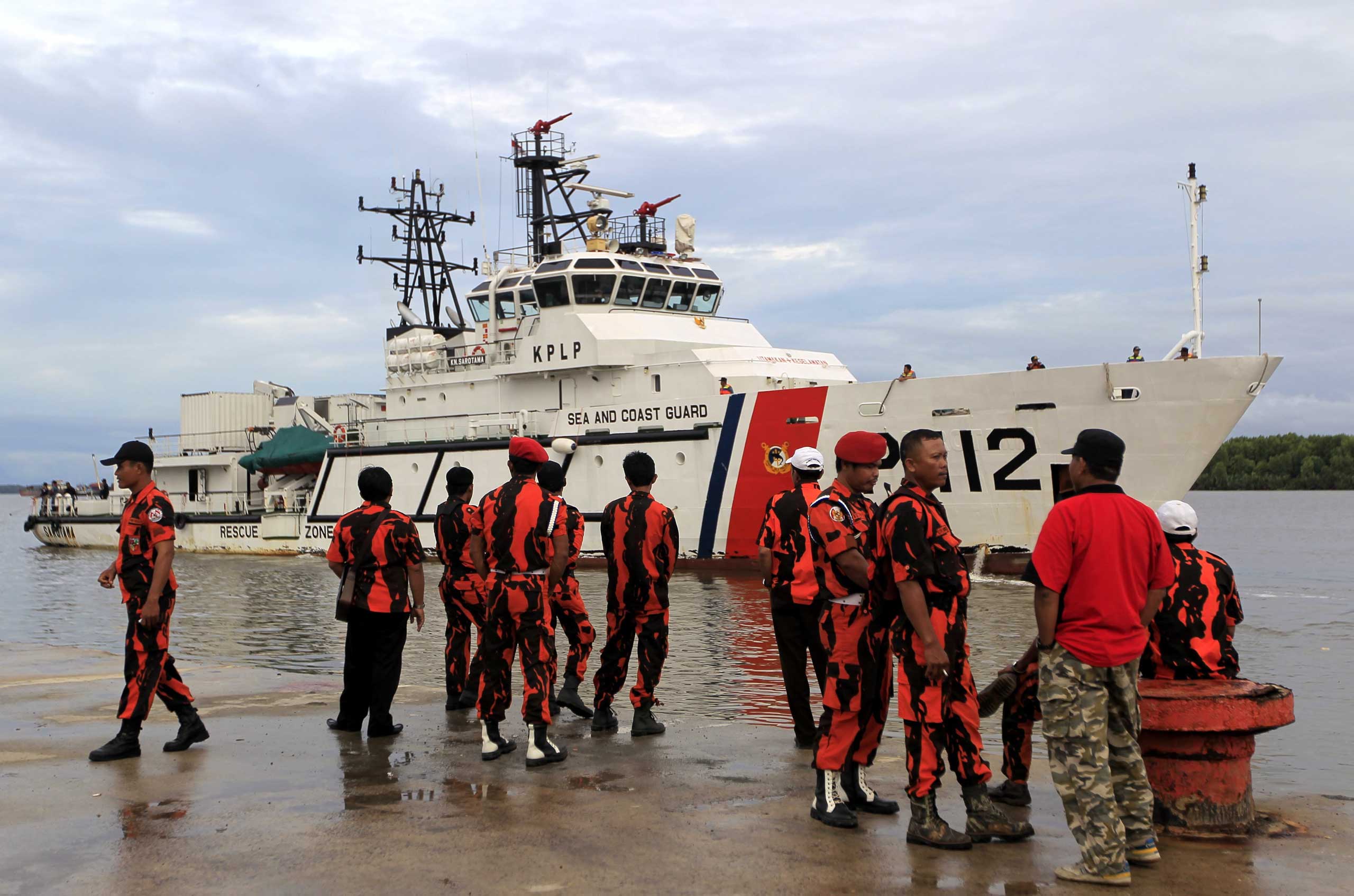 Indonesia's Sea and Coast Guard ship  during a search and rescue operation as they search for the missing AirAsia plane on Dec. 31. (Bagus Indahono—EPA)