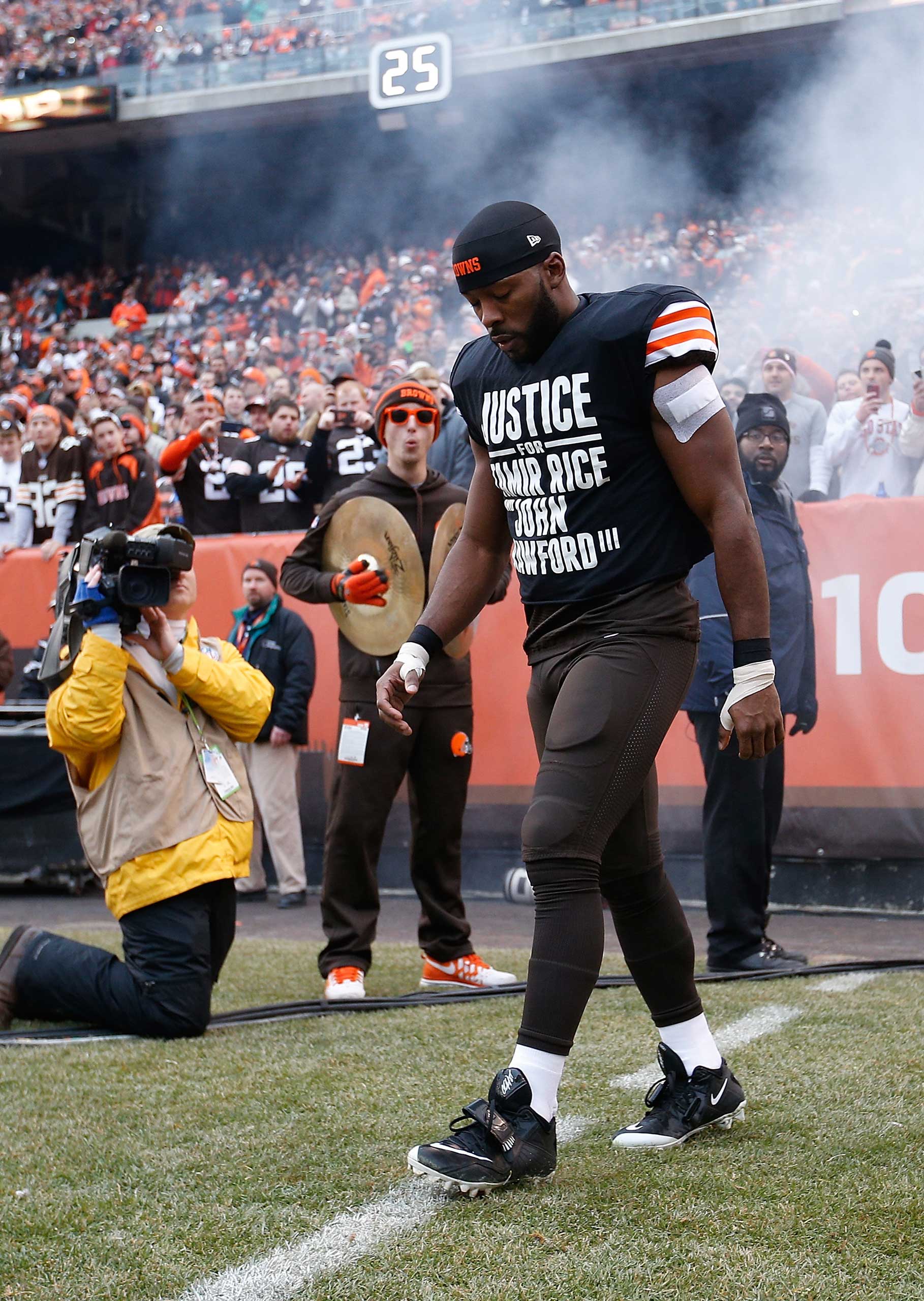 Andrew Hawkins #16 of the Cleveland Browns walks onto the field while wearing a protest shirt during introductions prior to the game against the Cincinnati Bengals at FirstEnergy Stadium in Cleveland on Dec. 14, 2014. (Joe Robbins—Getty Images)