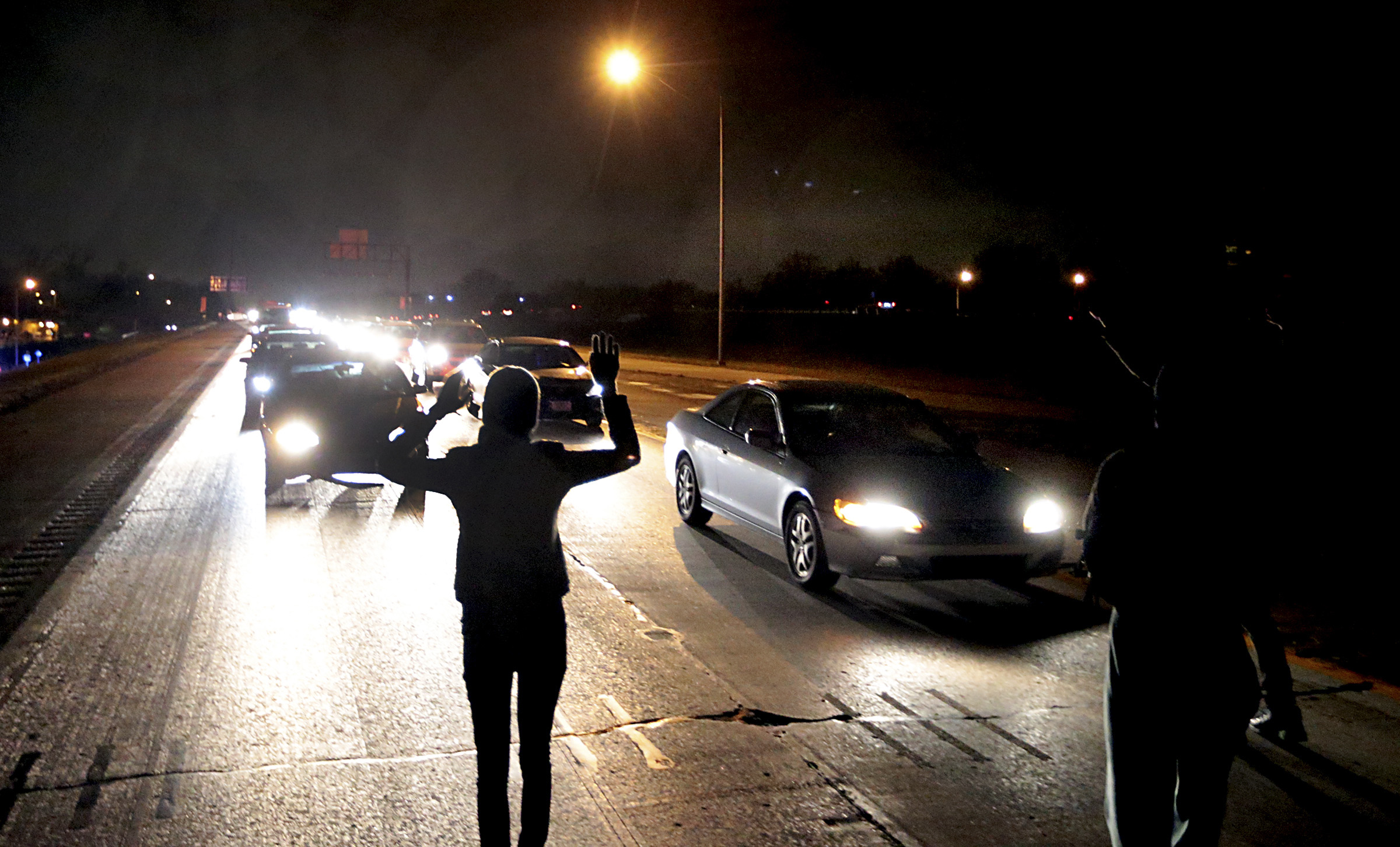 Protesters shut down an interstate at Airport Road on Dec. 24, 2014, in Berkeley, Mo.