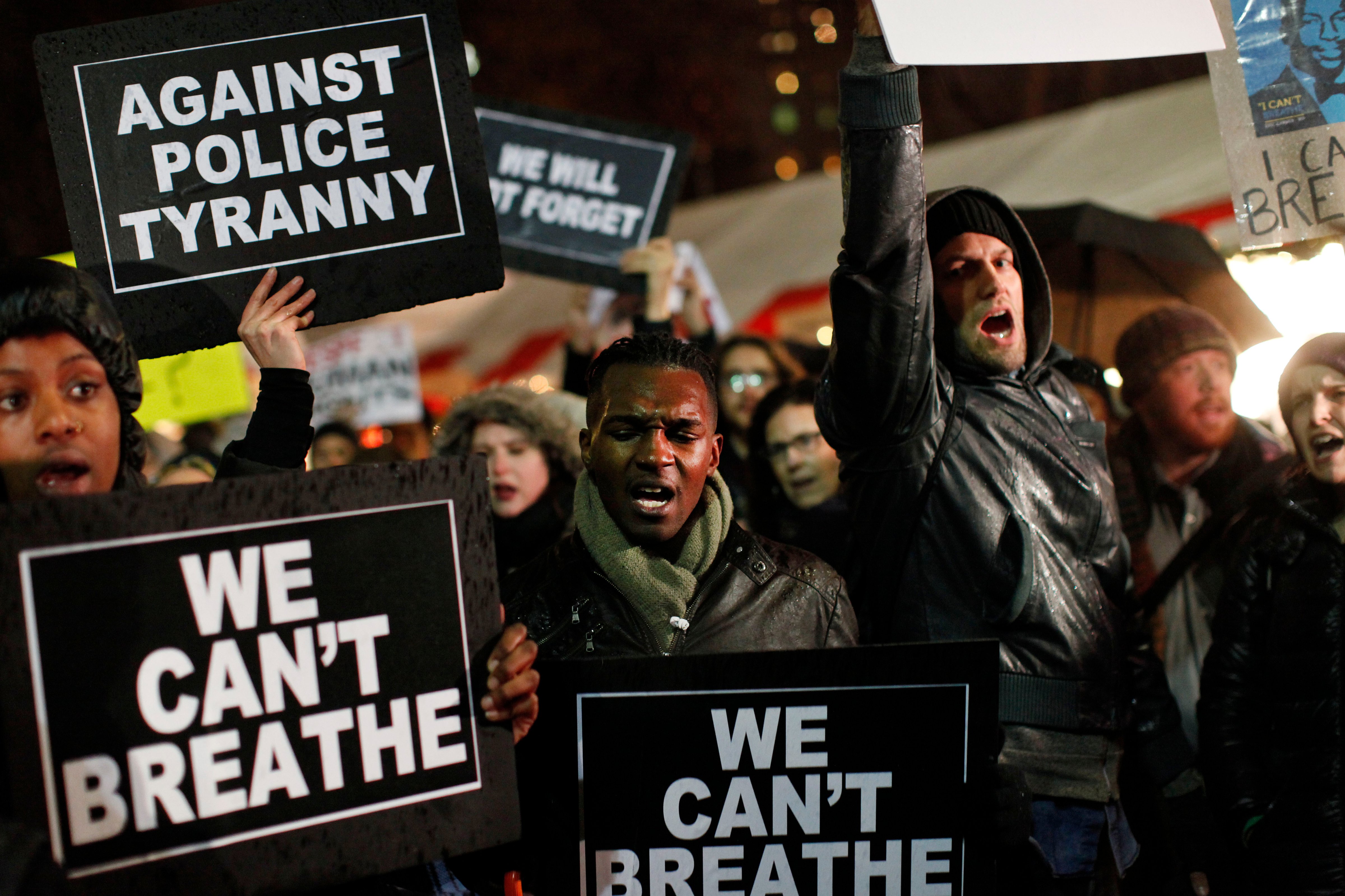 Protesters rallying against a grand jury's decision not to indict the police officer involved in the death of Eric Garner gather in Columbus Circle, Friday, Dec. 5, 2014, in New York. (Jason DeCrow—AP)