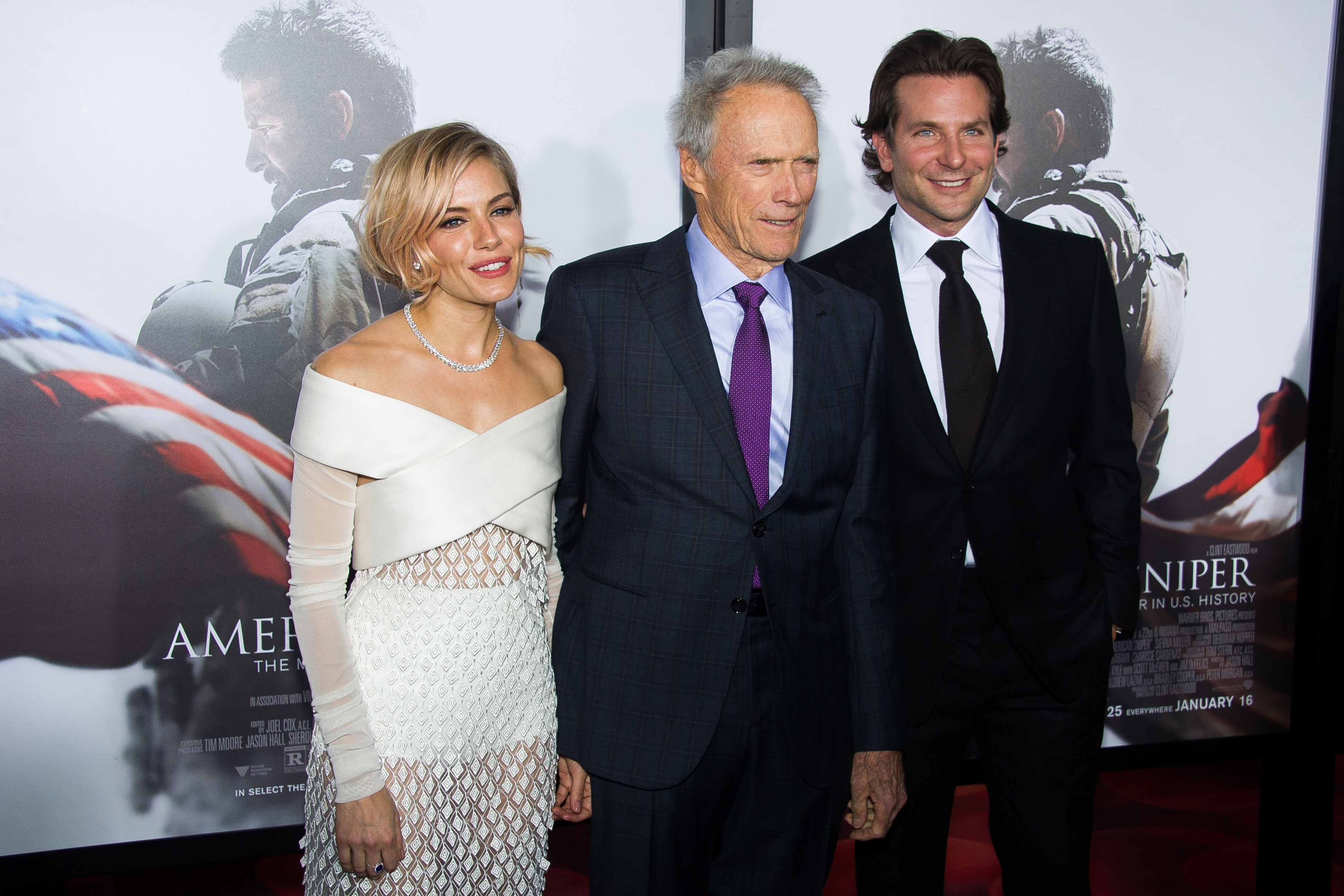 Sienna Miller, from left, Clint Eastwood and Bradley Cooper attend the 