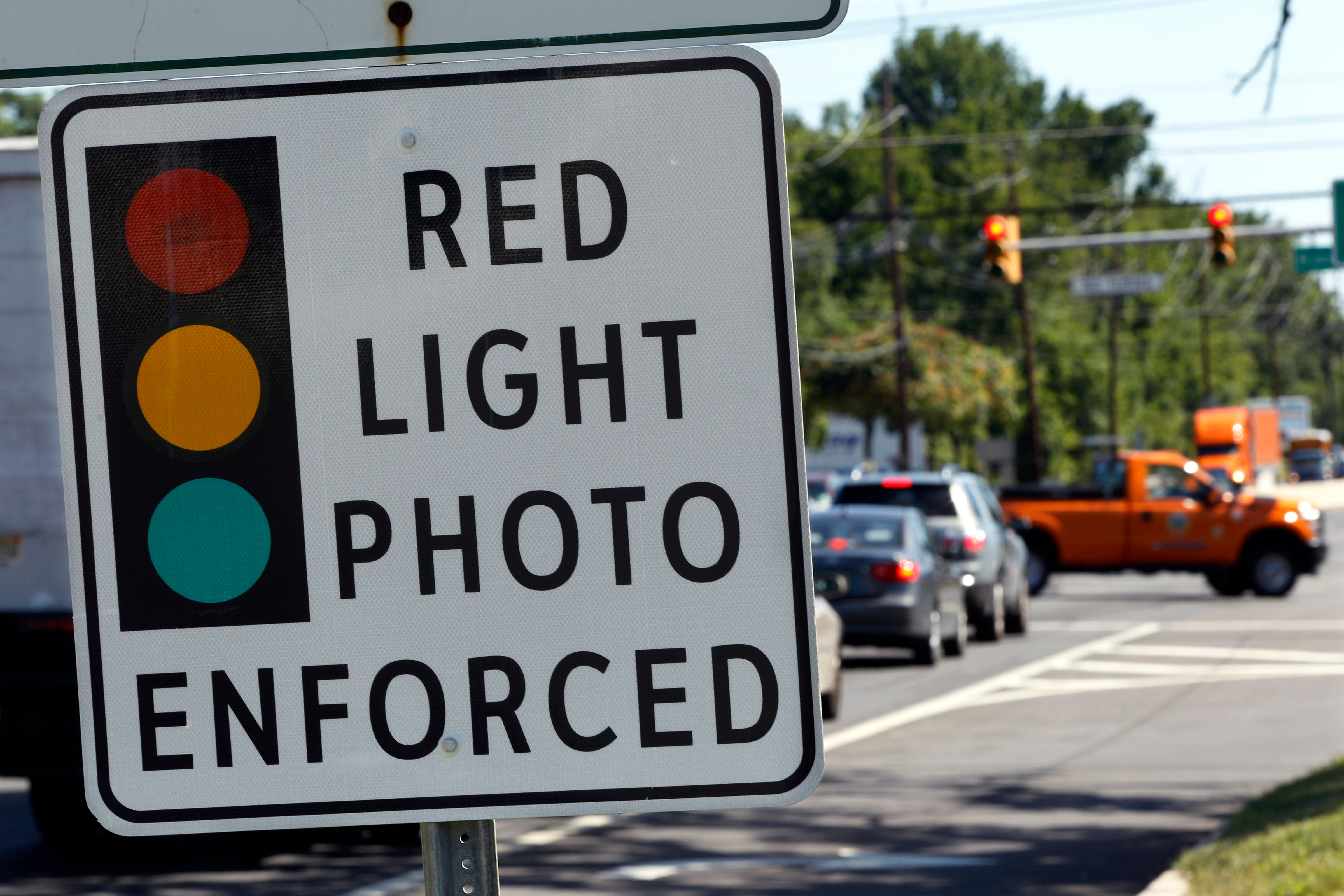 A red light photo enforcement sign is seen on Route 1 in Lawrence Township on July 25, 2012. New Jersey's red light camera pilot program will end Dec. 16, 2014. (Mel Evans—AP)