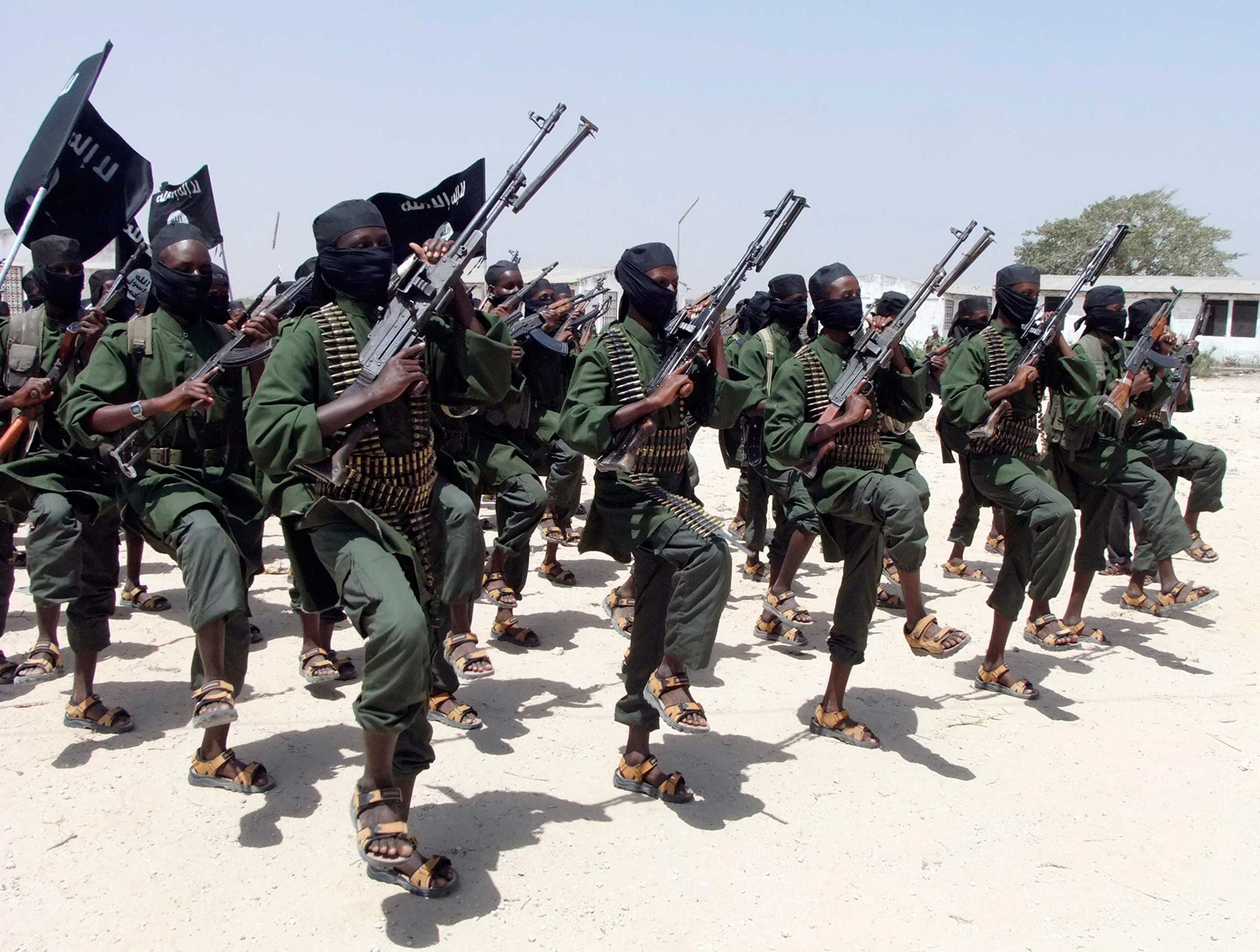 In this Thursday, Feb. 17, 2011 file photo, hundreds of newly trained al-Shabab fighters perform military exercises in the Lafofe area some 18km south of Mogadishu, in Somalia. A Somali intelligence official says Zakariya Ismail Ahmed Hersi, a leader with the Islamic extremist group al-Shabab who has a $3 million bounty on his head, has surrendered to police in Somalia. (Farah Abdi Warsameh—AP)