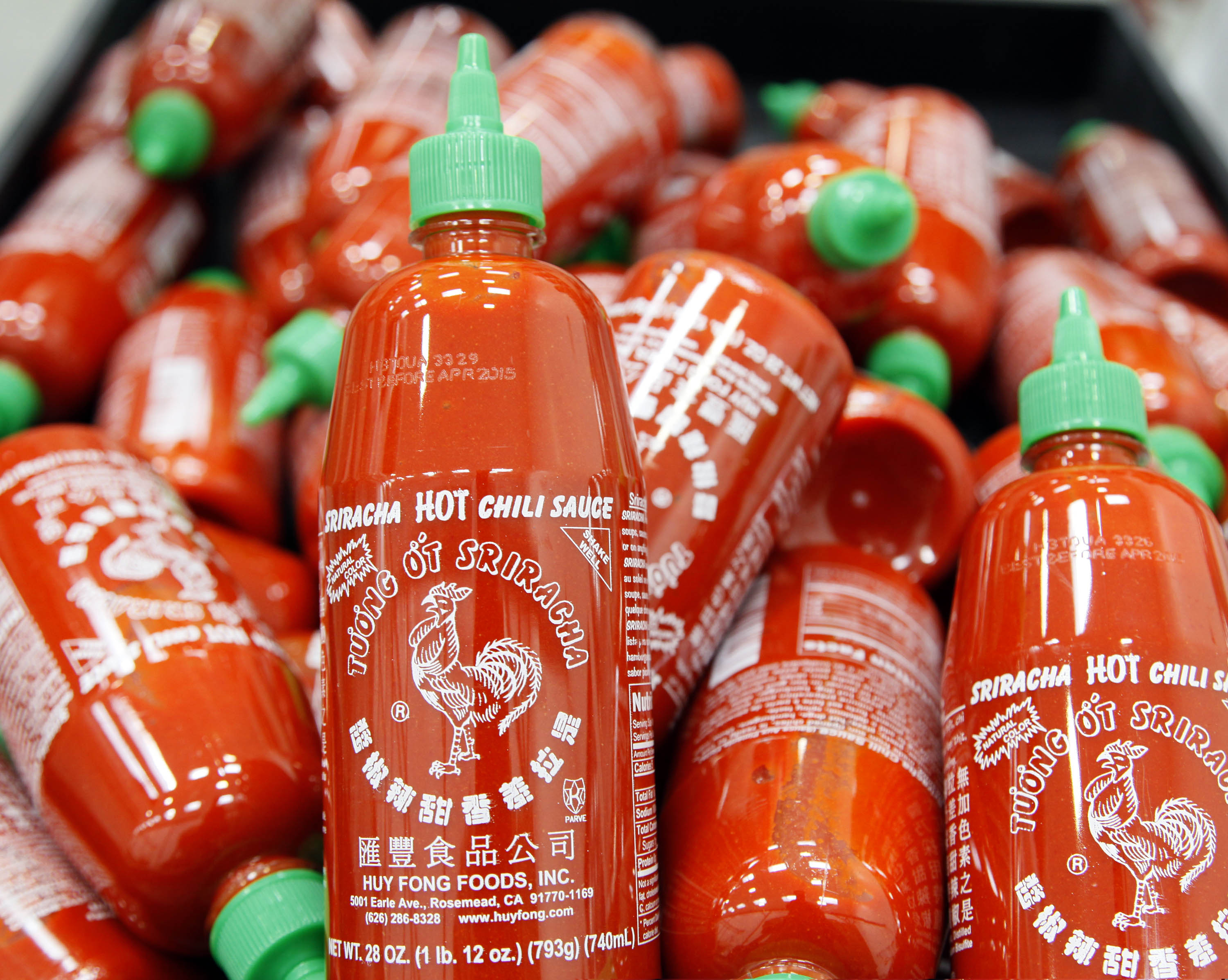 Sriracha chili sauce bottles are produced at the Huy Fong Foods factory in Irwindale, Calif. (Nick Ut—AP)