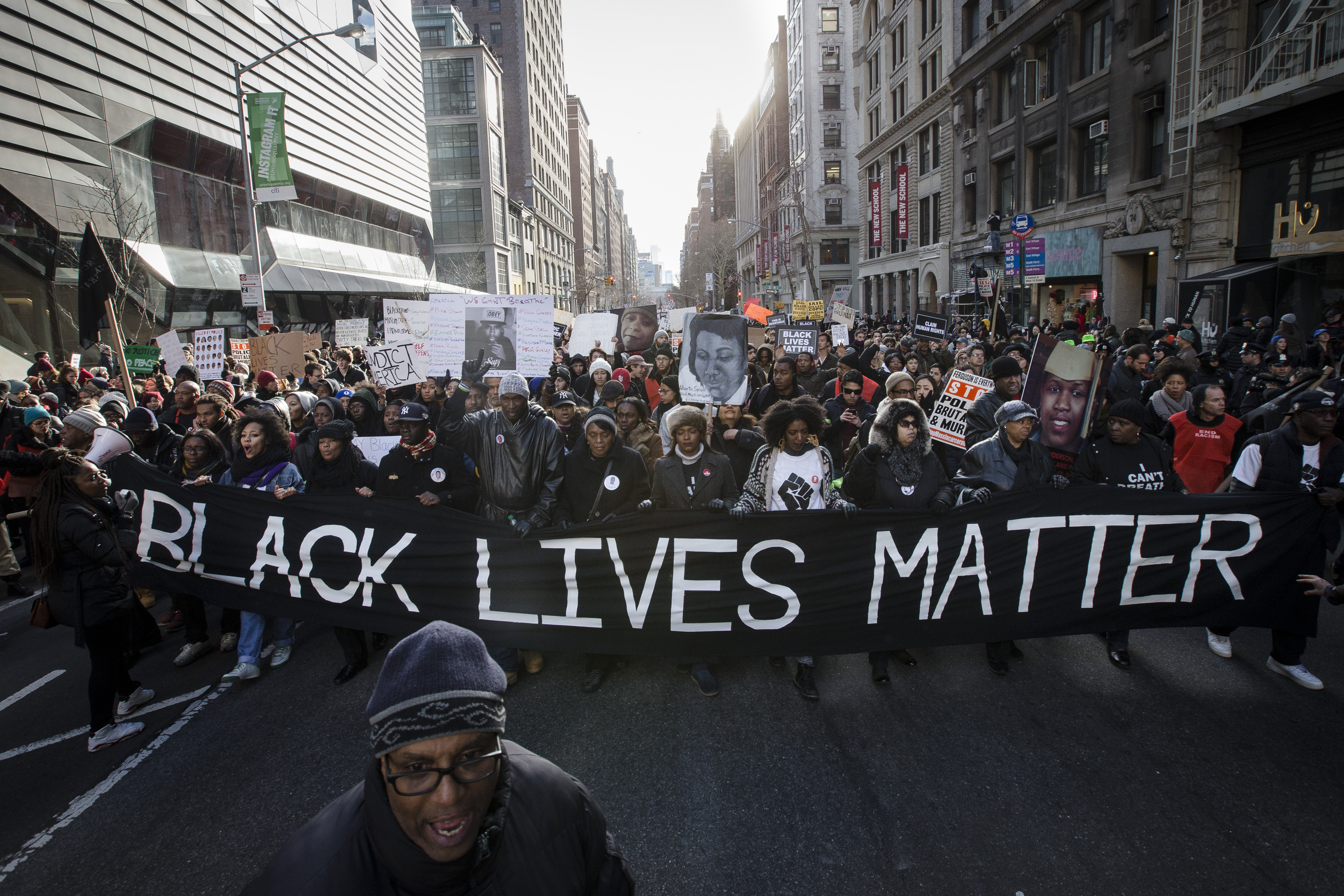 Demonstrators march in New York, Saturday, Dec. 13, 2014, during the Justice for All rally and march. In the past three weeks, grand juries have decided not to indict officers in the chokehold death of Eric Garner in New York and the fatal shooting of Michael Brown in Ferguson, Mo. The decisions have unleashed demonstrations and questions about police conduct and whether local prosecutors are the best choice for investigating police. (John Minchillo—AP)