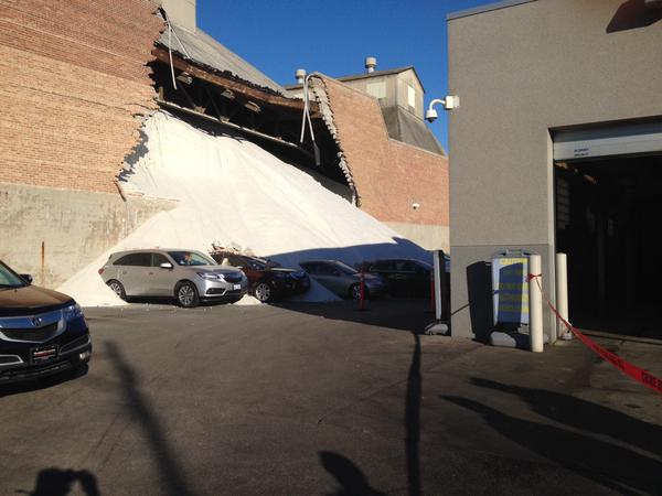 This image released by the Chicago Fire Department shows cars from an Acura dealership buried under salt after the collapse of a wall at the Morton Salt Facility in Chicago, Dec. 30, 2014 (Chicago Fire Department)