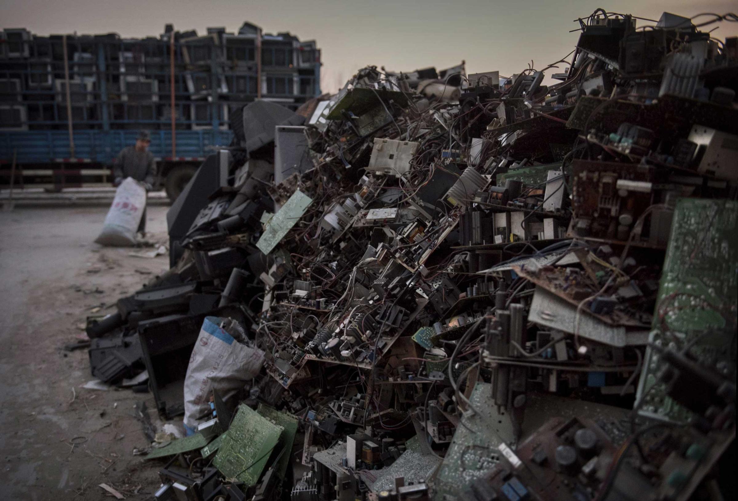 Discarded computer and electronics parts wait to be recycled in the Dong Xiao Kou village on Dec. 11, 2014 in Beijing.