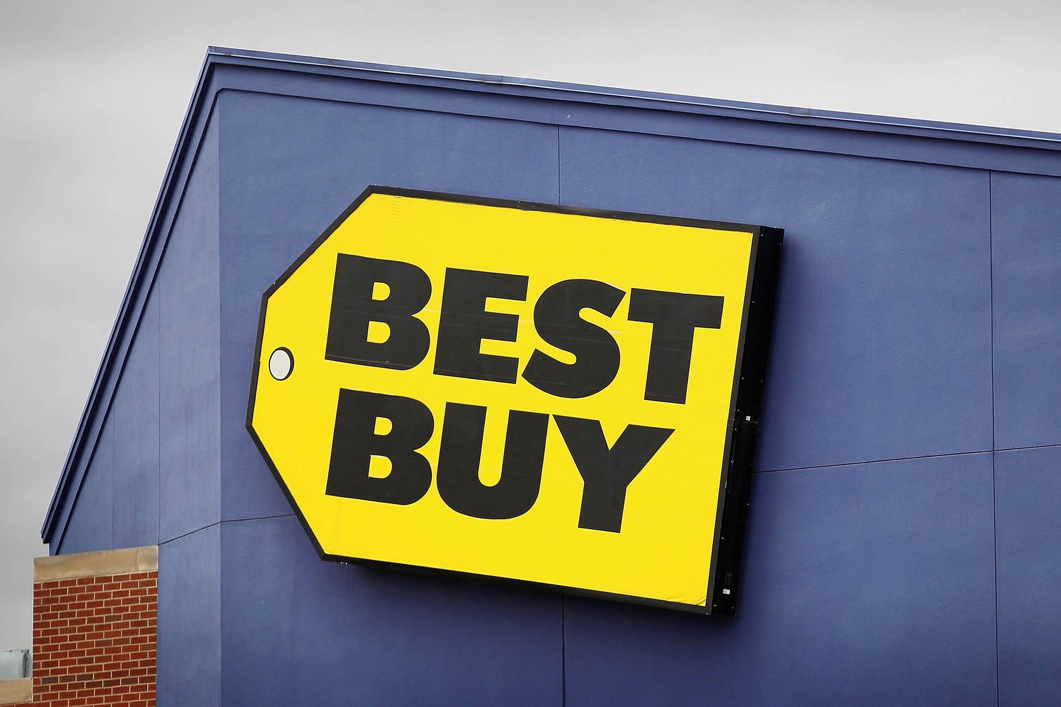 The Best Buy logo hangs above a store on April 16, 2012 in Chicago, Illinois. (Scott Olson—Getty Images)