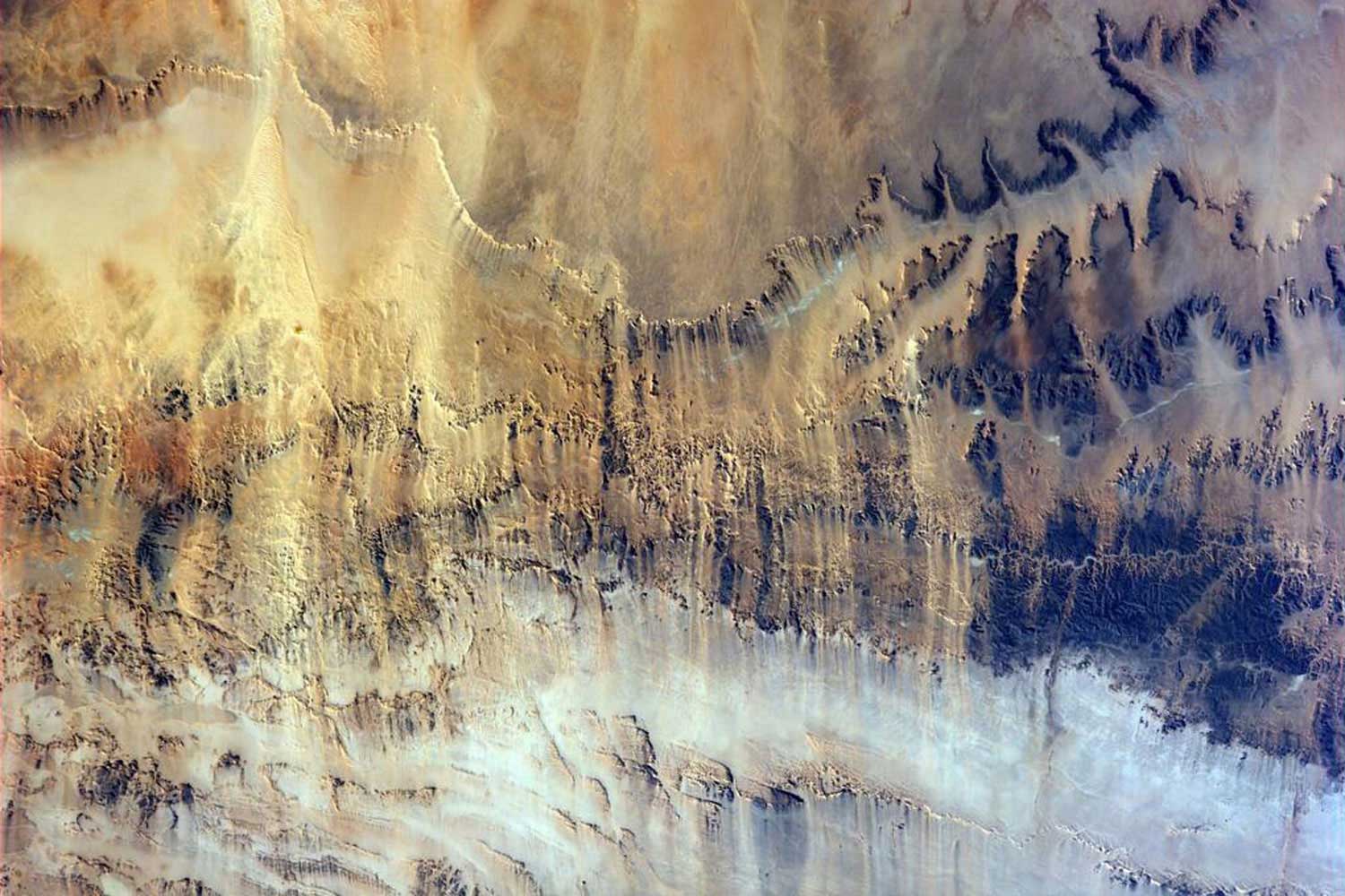 Astronaut Alexander Gerst ‏tweeted this photo on July 6, 2014 from the International Space Station  Harsh land. Windswept valleys in northern #Africa / Hartes Land