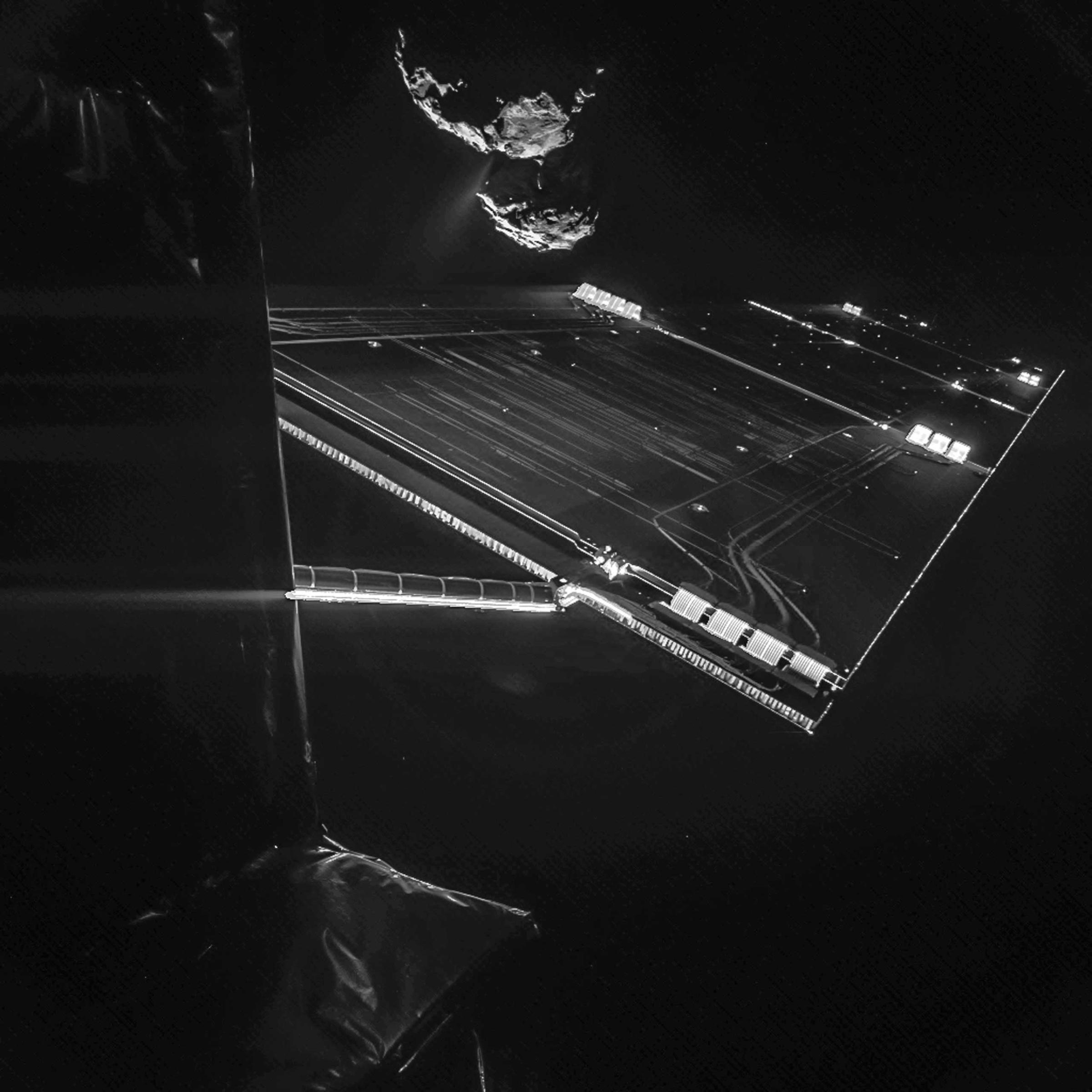 This selfie composed of two different images shows the Rosetta spacecraft as it soars past a comet on Oct. 7, 2014.