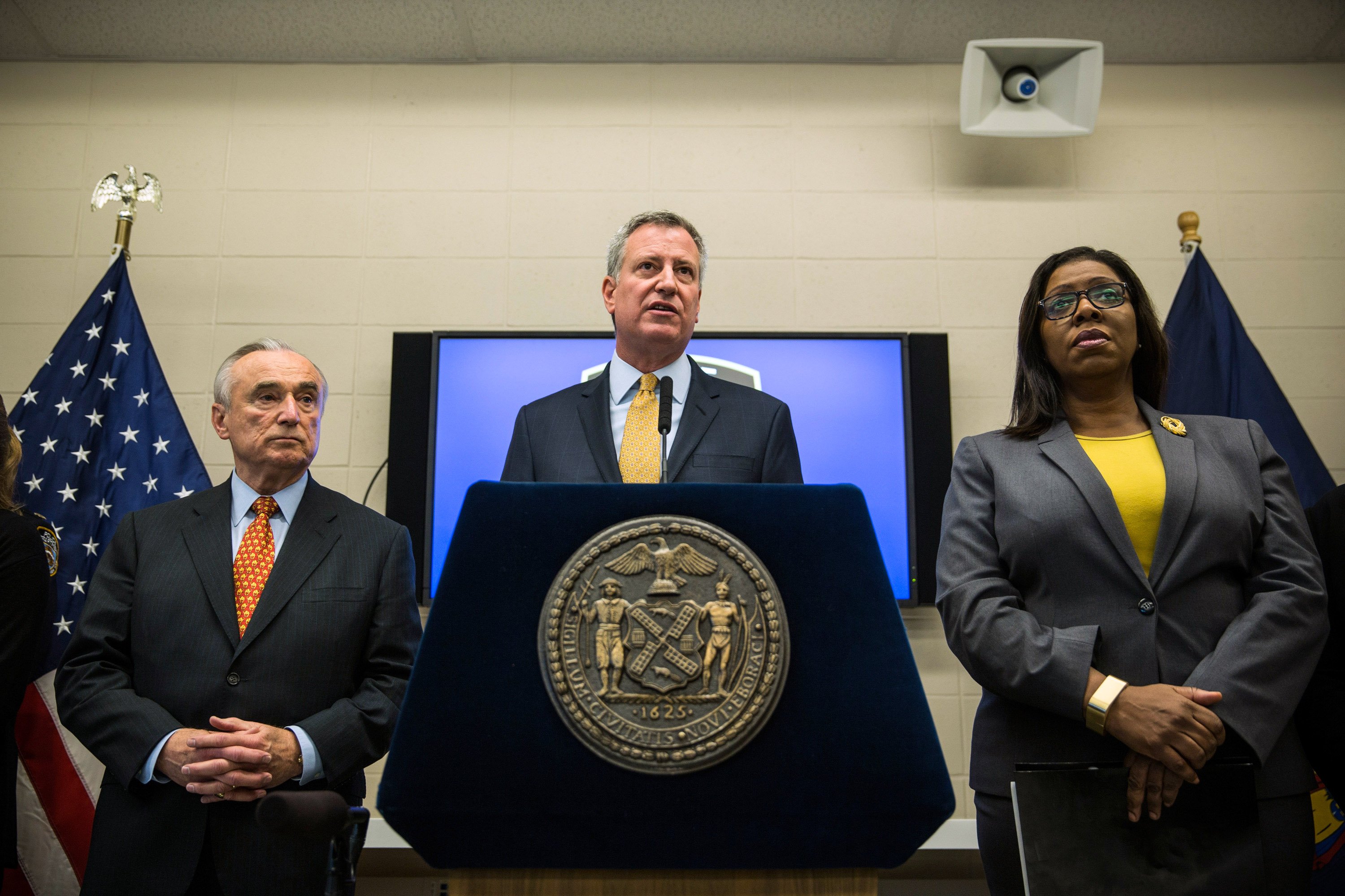 New York Police Department (NYPD) Commisioner Bill Bratton (L) and New York City Mayor Bill de Blasio speak about body cameras that the NYPD will begin using during a press conference on December 3, 2014 in New York City. (Andrew Burton—Getty Images)
