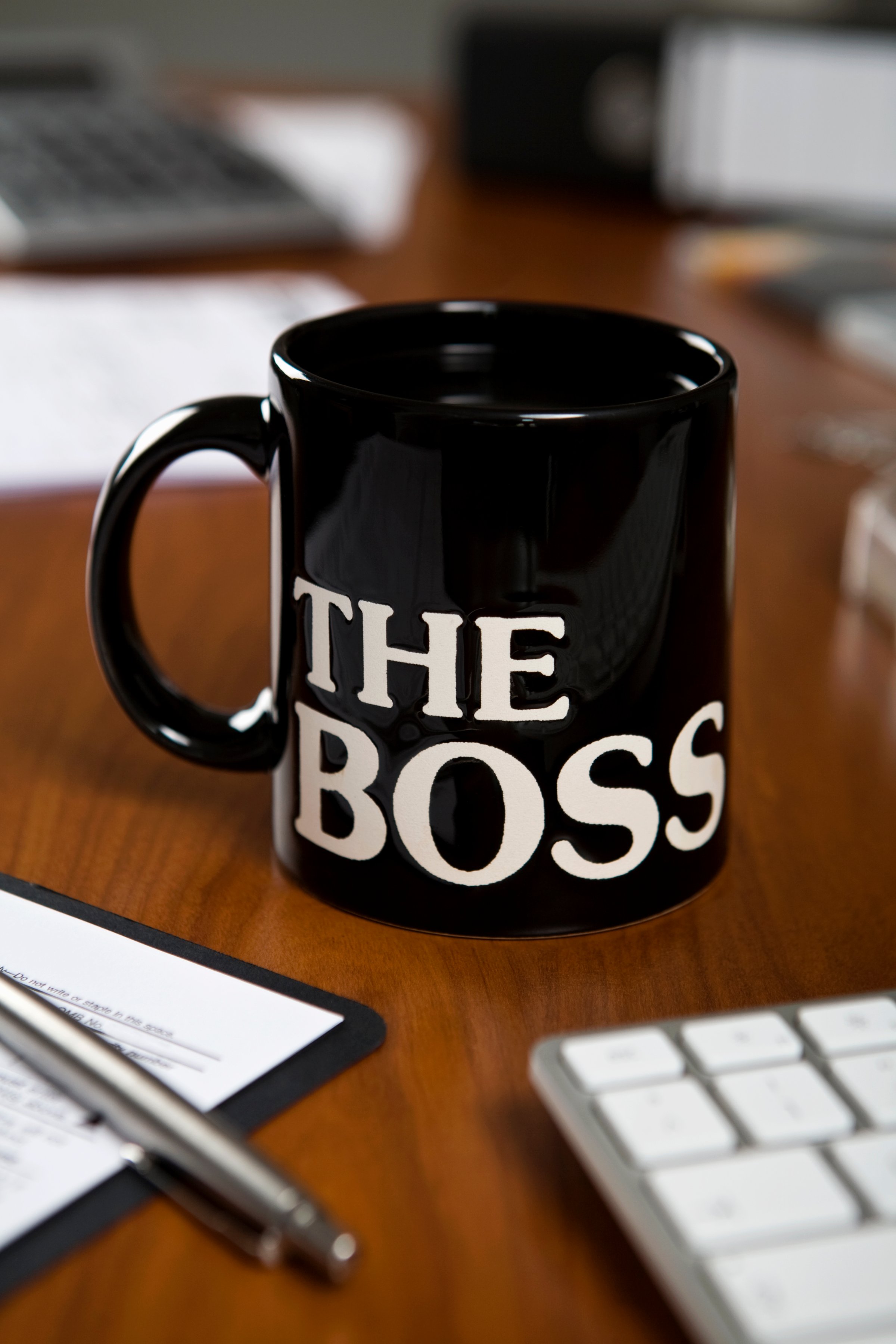 The Boss mug on a desk