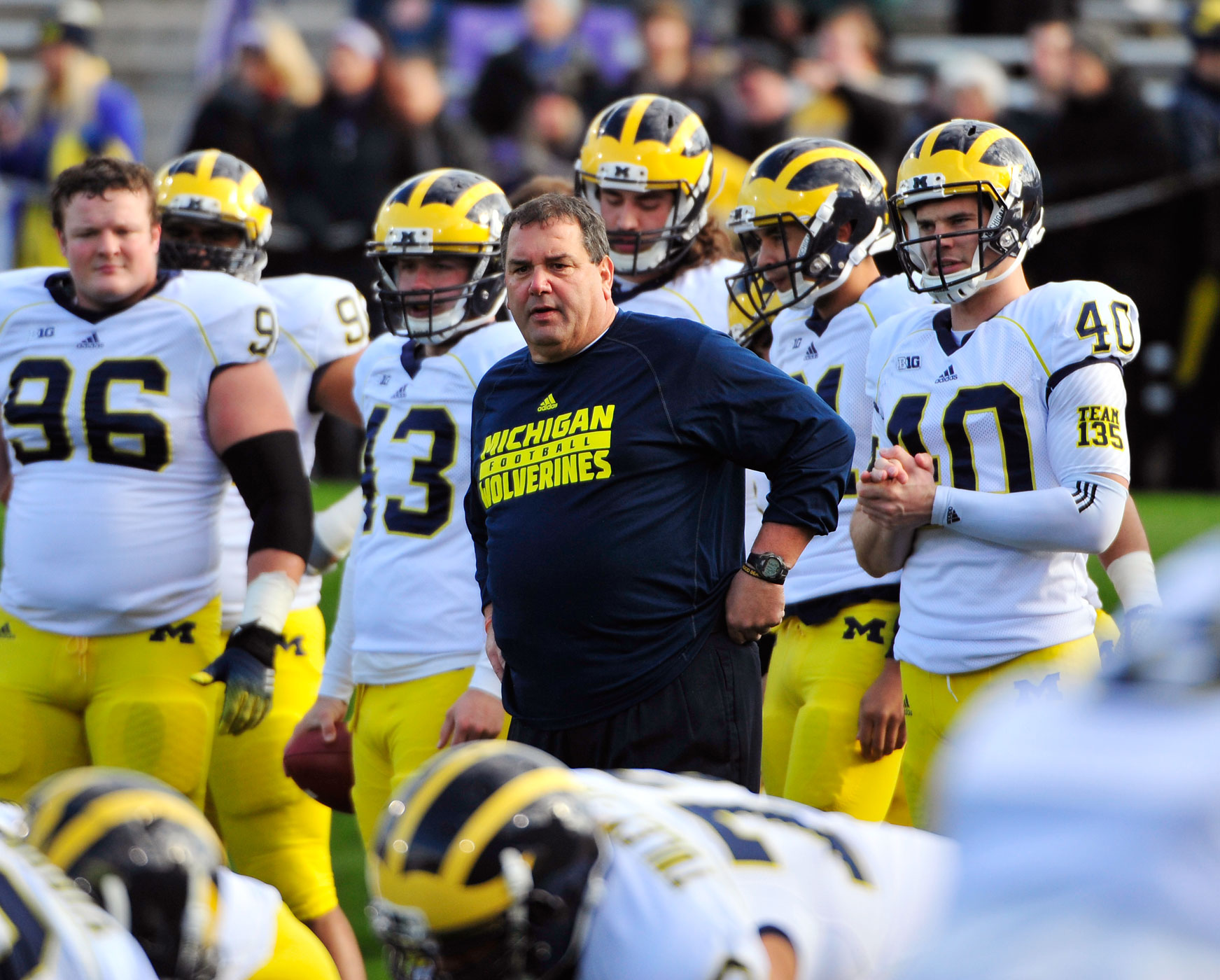 Head coach Brady Hoke of the Michigan Wolverines watches his team warm up before a game against the Northwestern Wildcats on November 8, 2014 at Ryan Field in Evanston, Illinois. (David Banks—Getty Images)