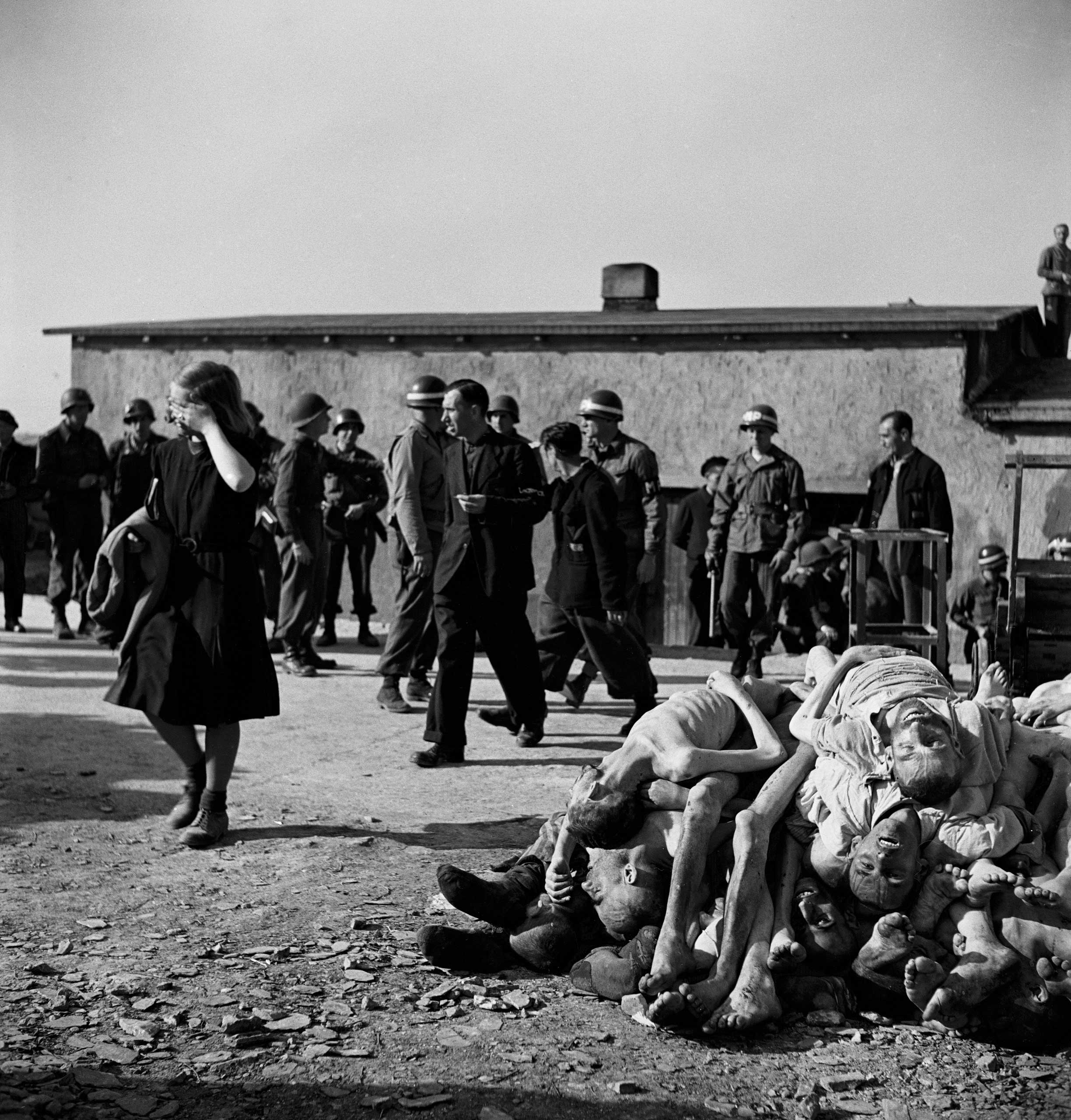 Not published in LIFE. German civilians are forced by American troops to bear witness to Nazi atrocities at Buchenwald concentration camp, mere miles from their own homes, April 1945.
