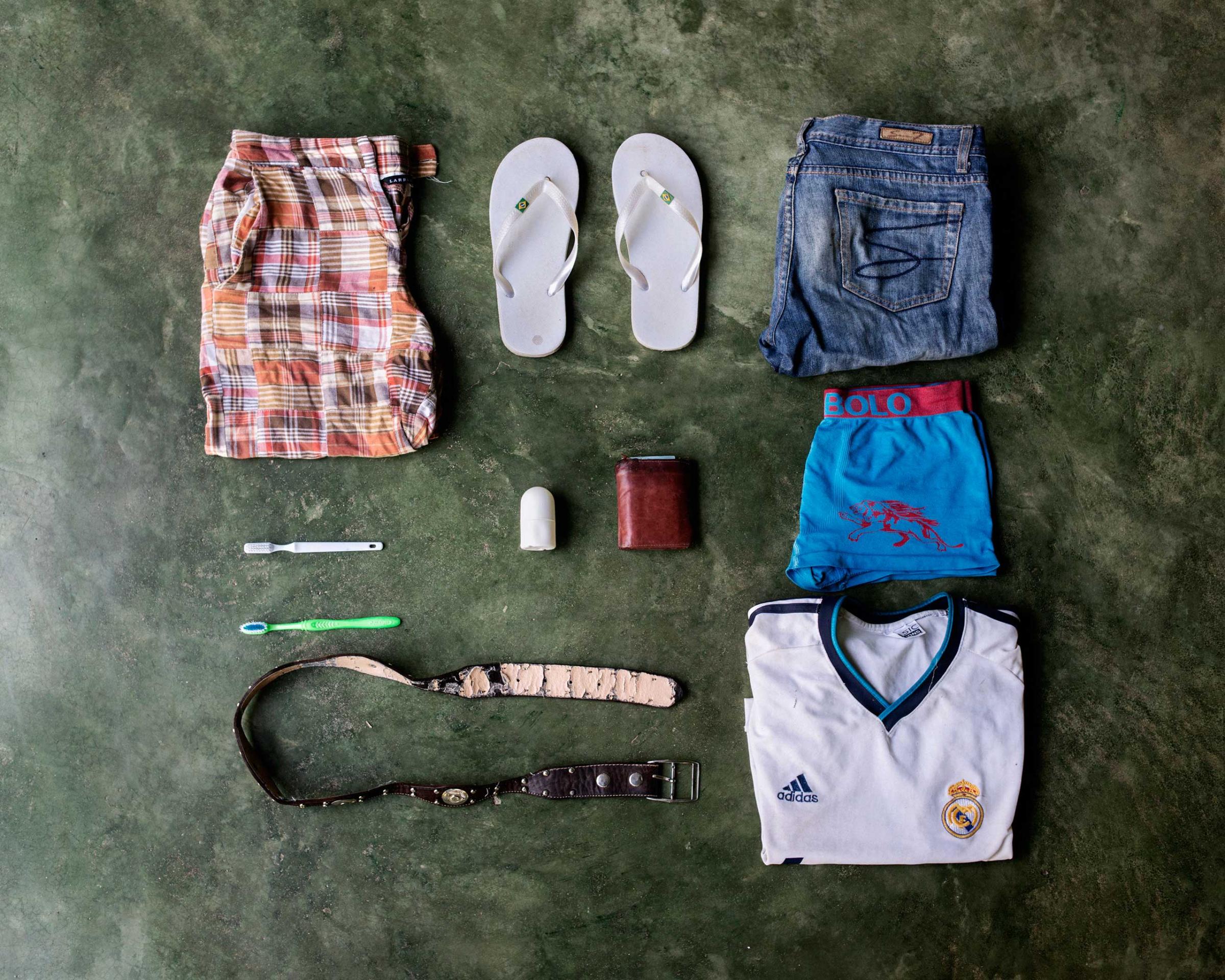 José Alfredo Bin, 27, from Guatemala. Deported from Mexico while he was trying to get to Miami, wants to go to U.S.A. to earn more money. In his bag has a pair of shorts, flip-flops, a pair of pants, two toothbrushes, deodorant, wallet, underwear, belt and a t-shirt of Real Madrid.