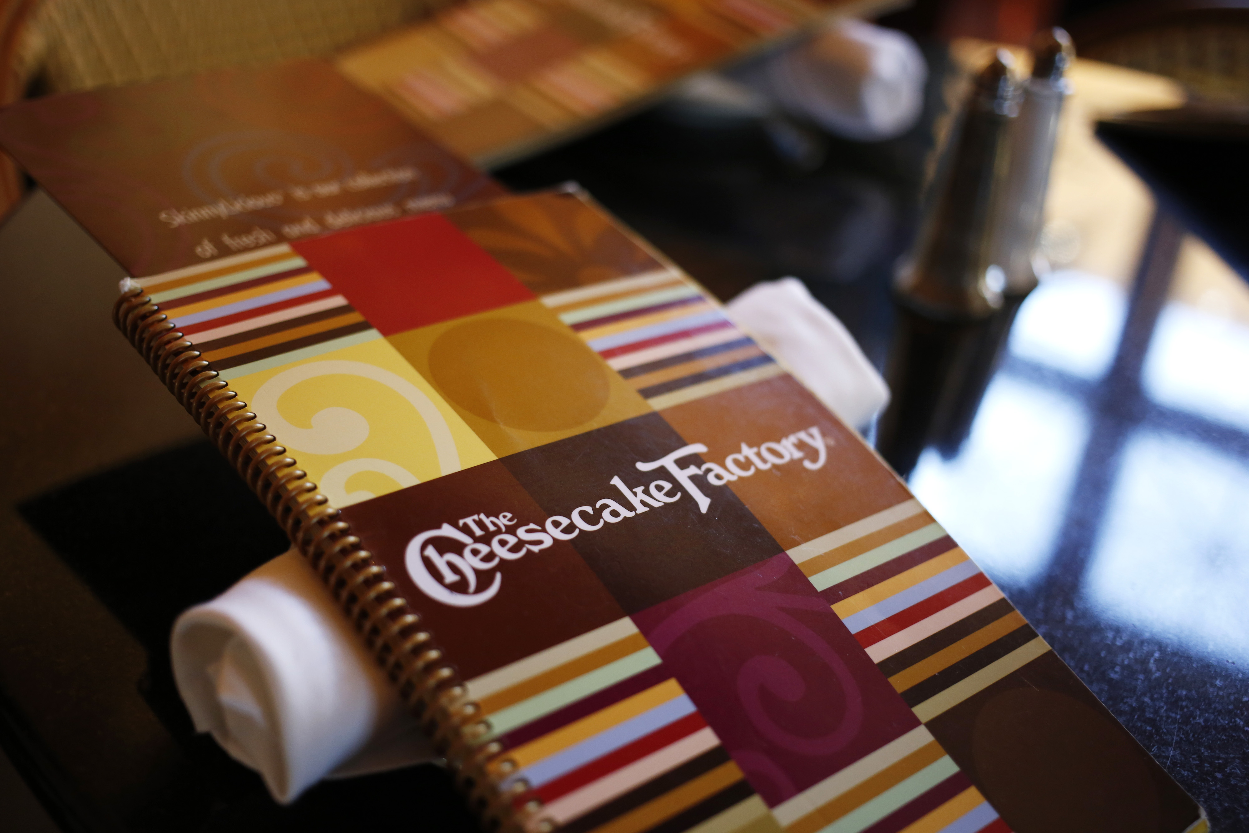 A menu sits on a table at a Cheesecake Factory restaurant in Louisville, Kentucky on Nov. 13, 2013. (Bloomberg—Bloomberg via Getty Images)