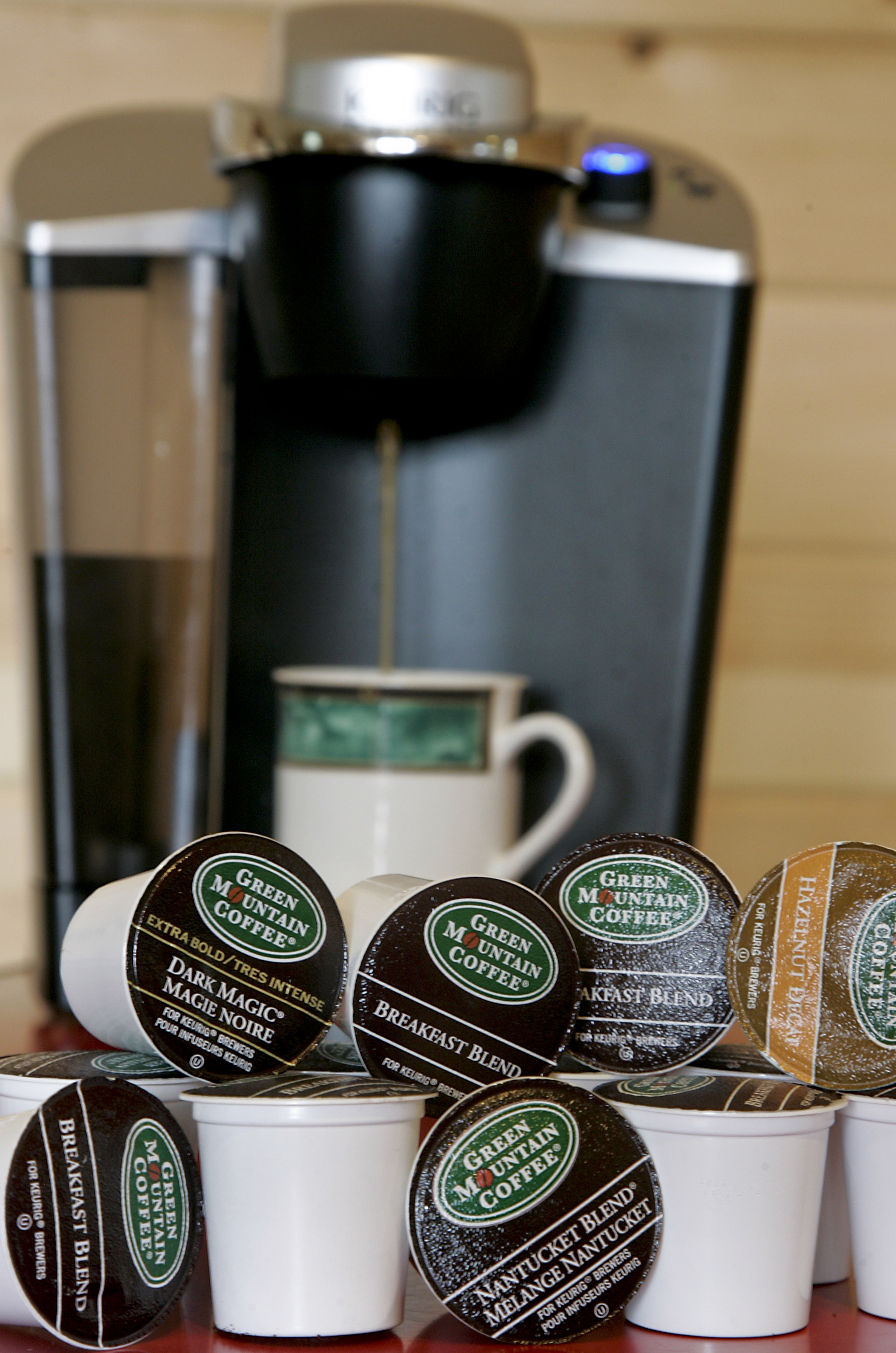 A coffee maker made by Keurig, a unit of Green Mountain Coffee Roasters Inc. K-Cups are arranged for a photo in Waterbury, Vt, on July 19, 2010. (Bloomberg via Getty Images)