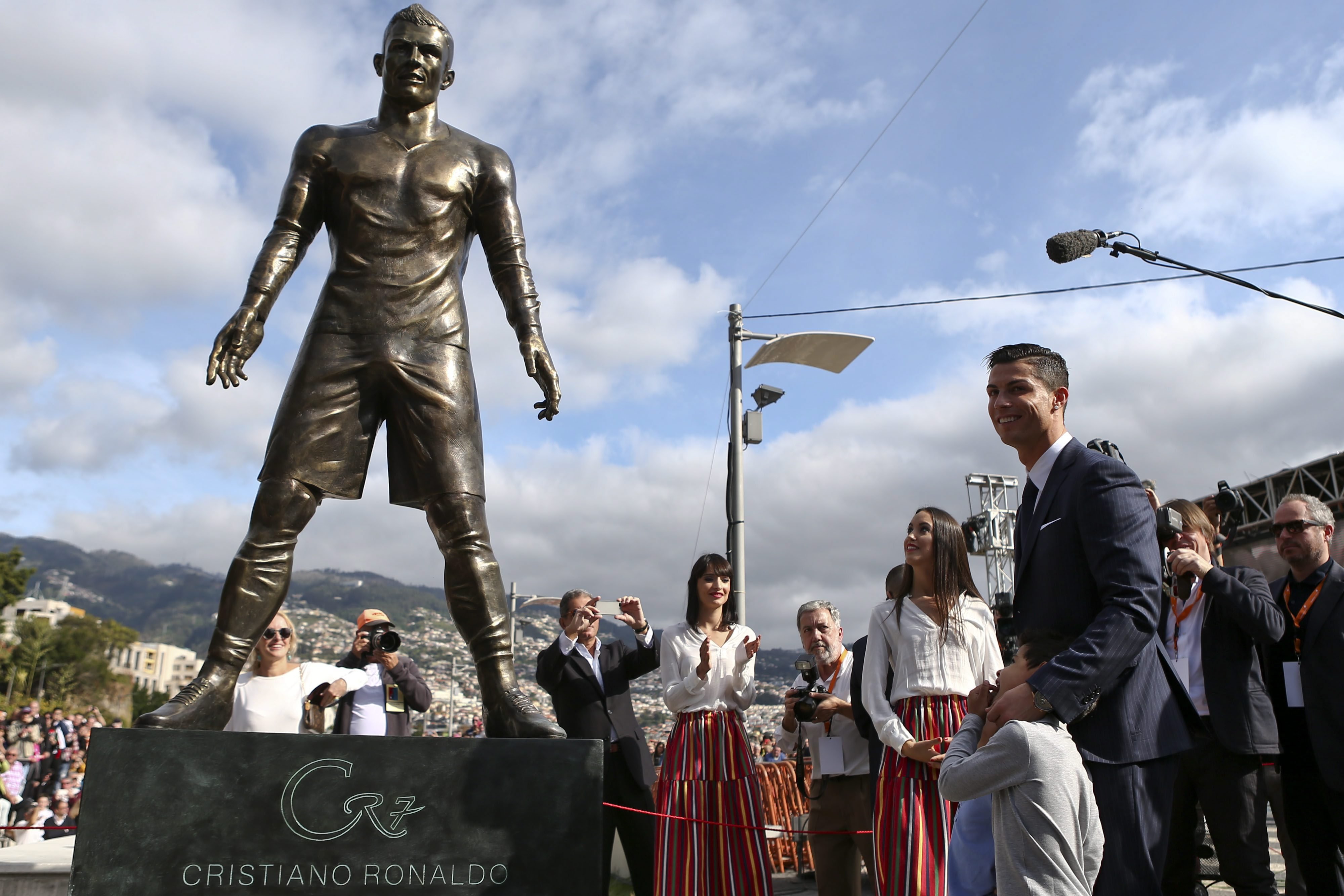 Portuguese soccer player Cristiano Ronaldo from Real Madrid poses during the unveiling ceremony of a statue of himself in his hometown of Funchal, Madeira Island on Dec. 21 2014. (Jose Sena Goulao—EPA)