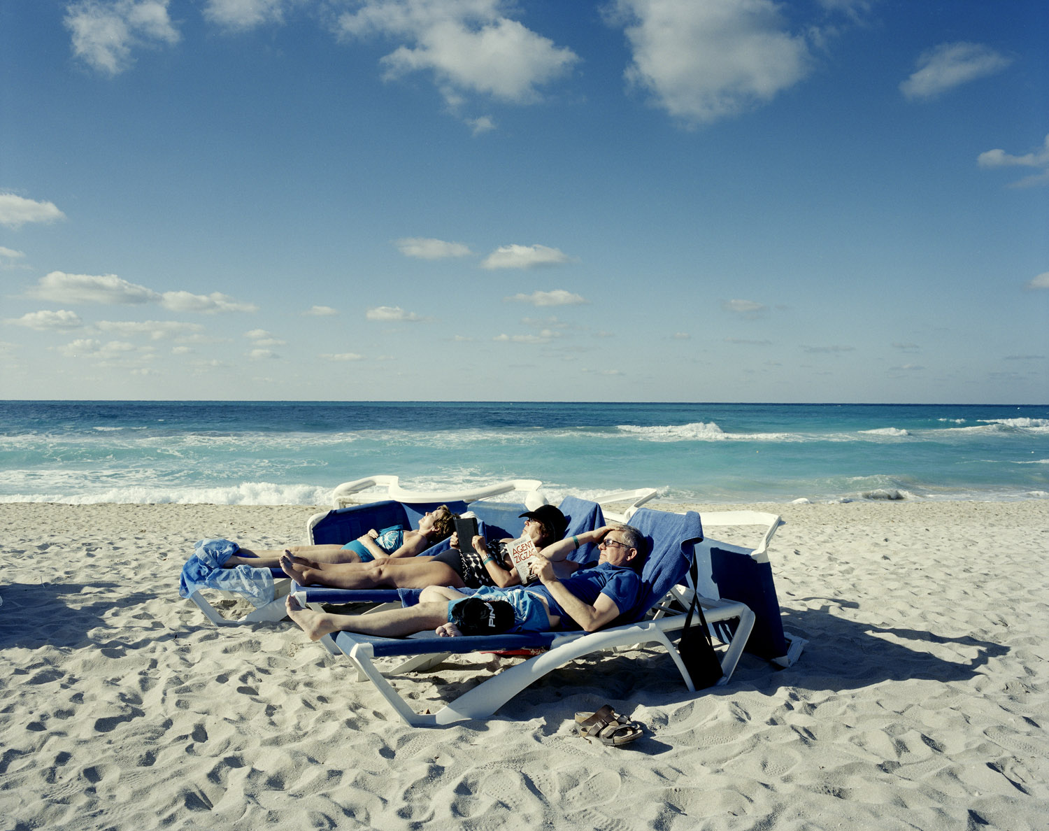 Tourists relax on lounge chairs at Melia Las Americas in Varadero, which is next to the only 18-hole golf course in Cuba.