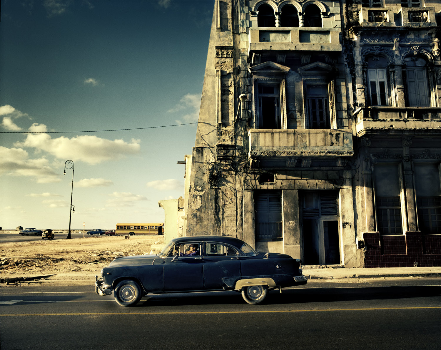 Outside Havana, an old American car with a new Japanese engine is used as a taxi.