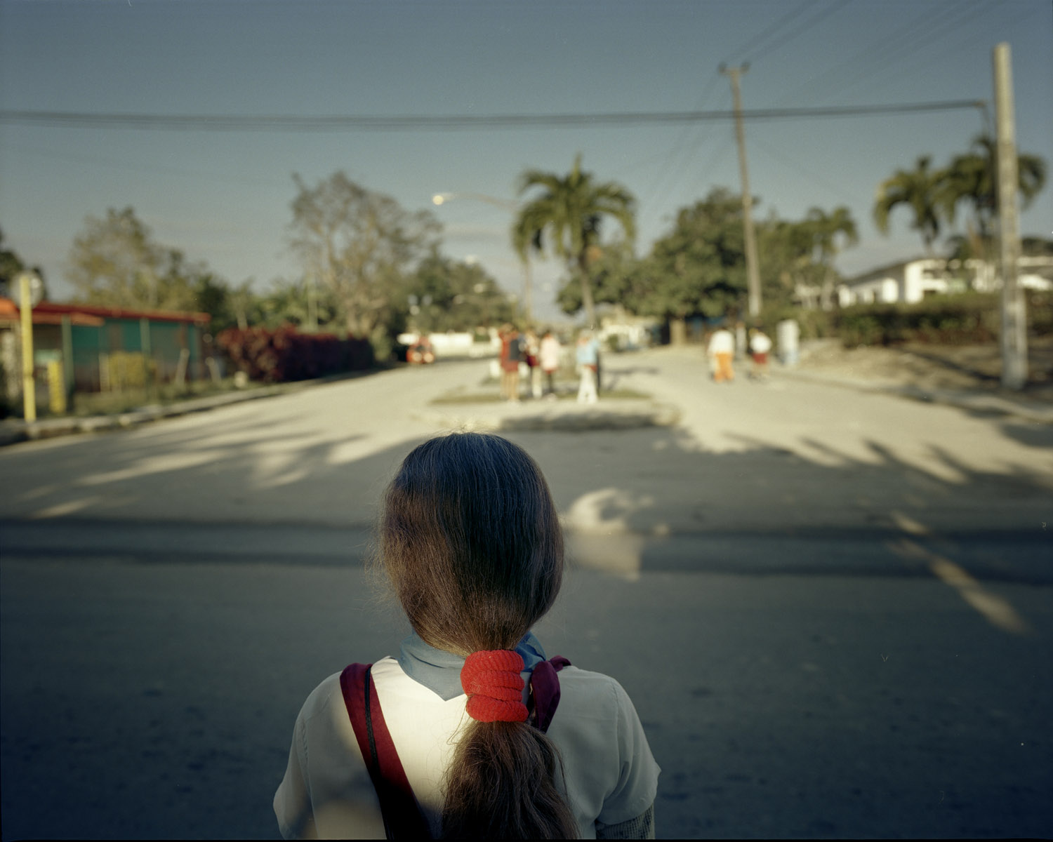 Alicia, 8, crosses the street to buy candy in Patricia’s Cafeteria, 2 miles from Guanabo beach.