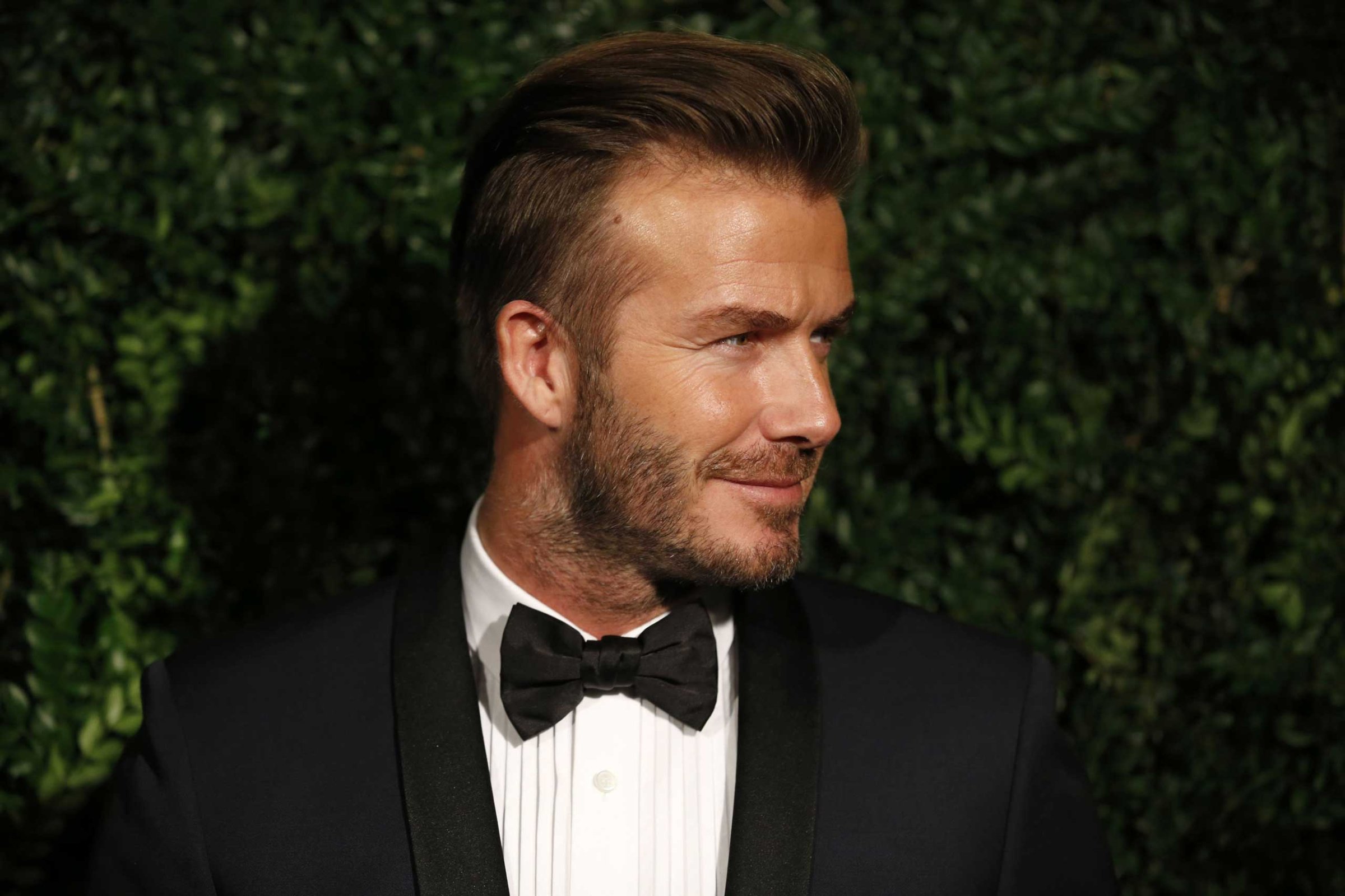 David Beckham poses on the red carpet as he attends the 60th London Evening Standard Theatre Awards 2014 in London on Nov. 30, 2014.