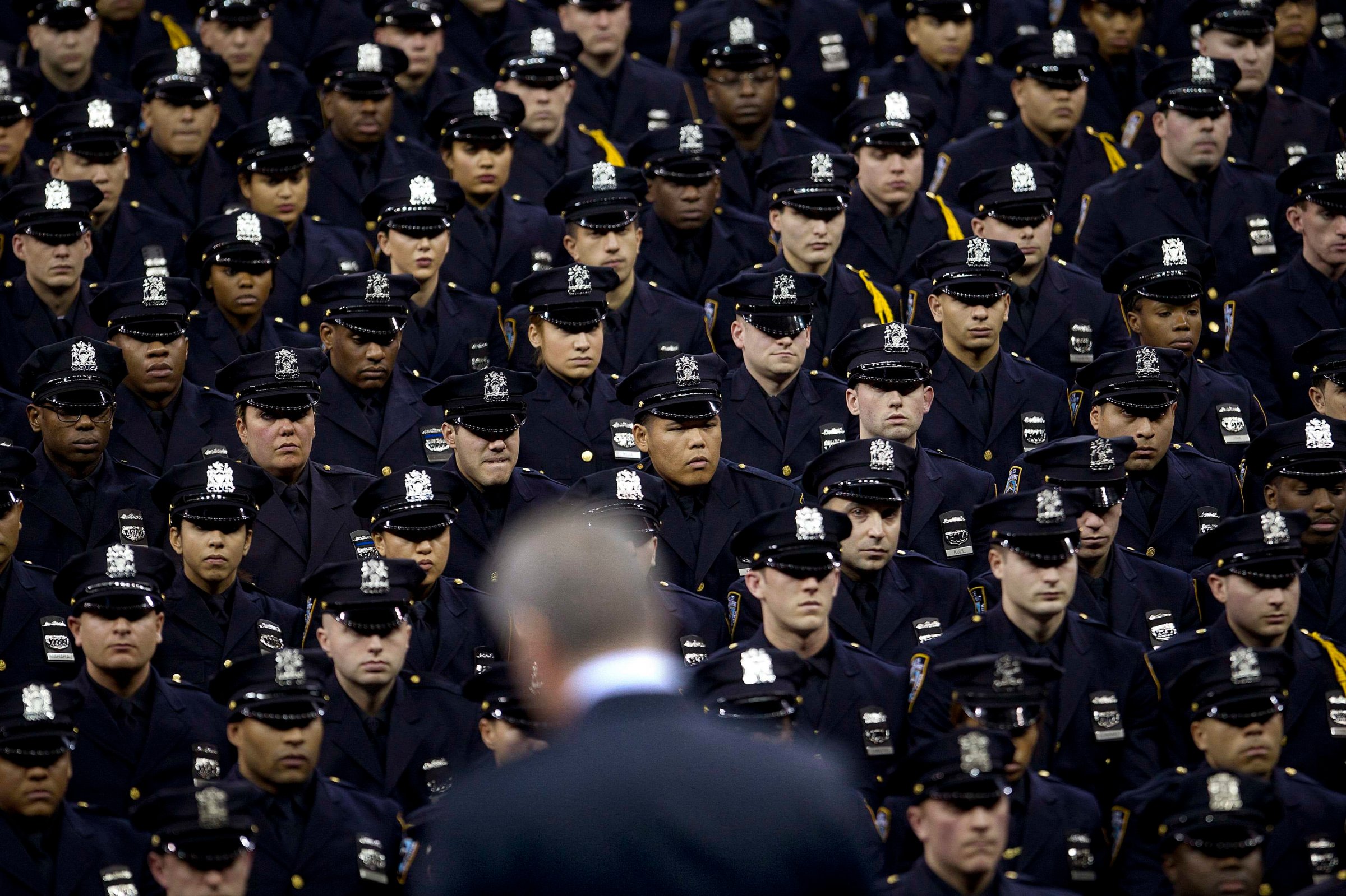 Blasio speaks from the podium to the New York City Police Academy Graduating class in New York